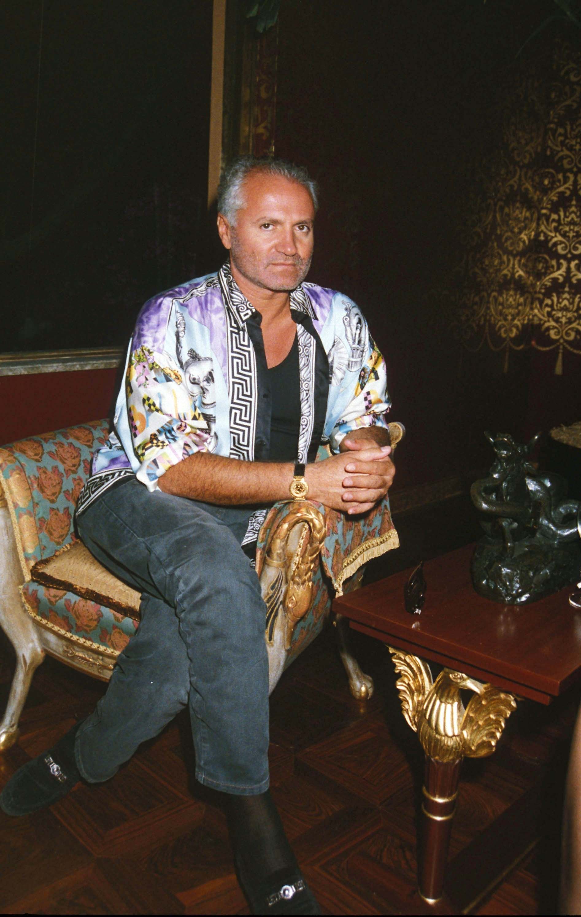 Gianni Versace at Sylvester Stallone's house warming party in the United Kingdom, circa 1991 | Photo: Dave Benett/Getty Images