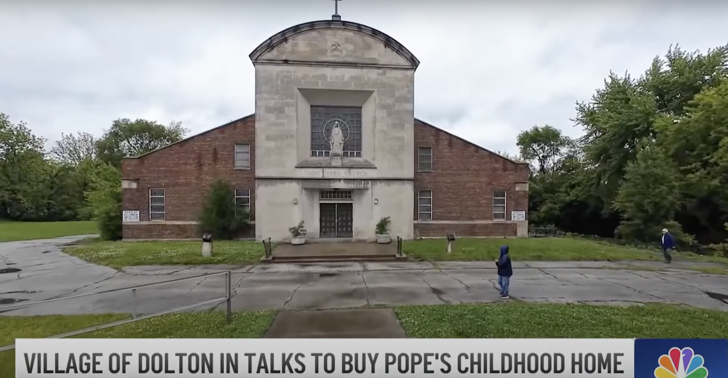 A screenshot of St. Mary of the Assumption Church and school from a video dated May 23, 2025. | Source: YouTube/NBC Chicago