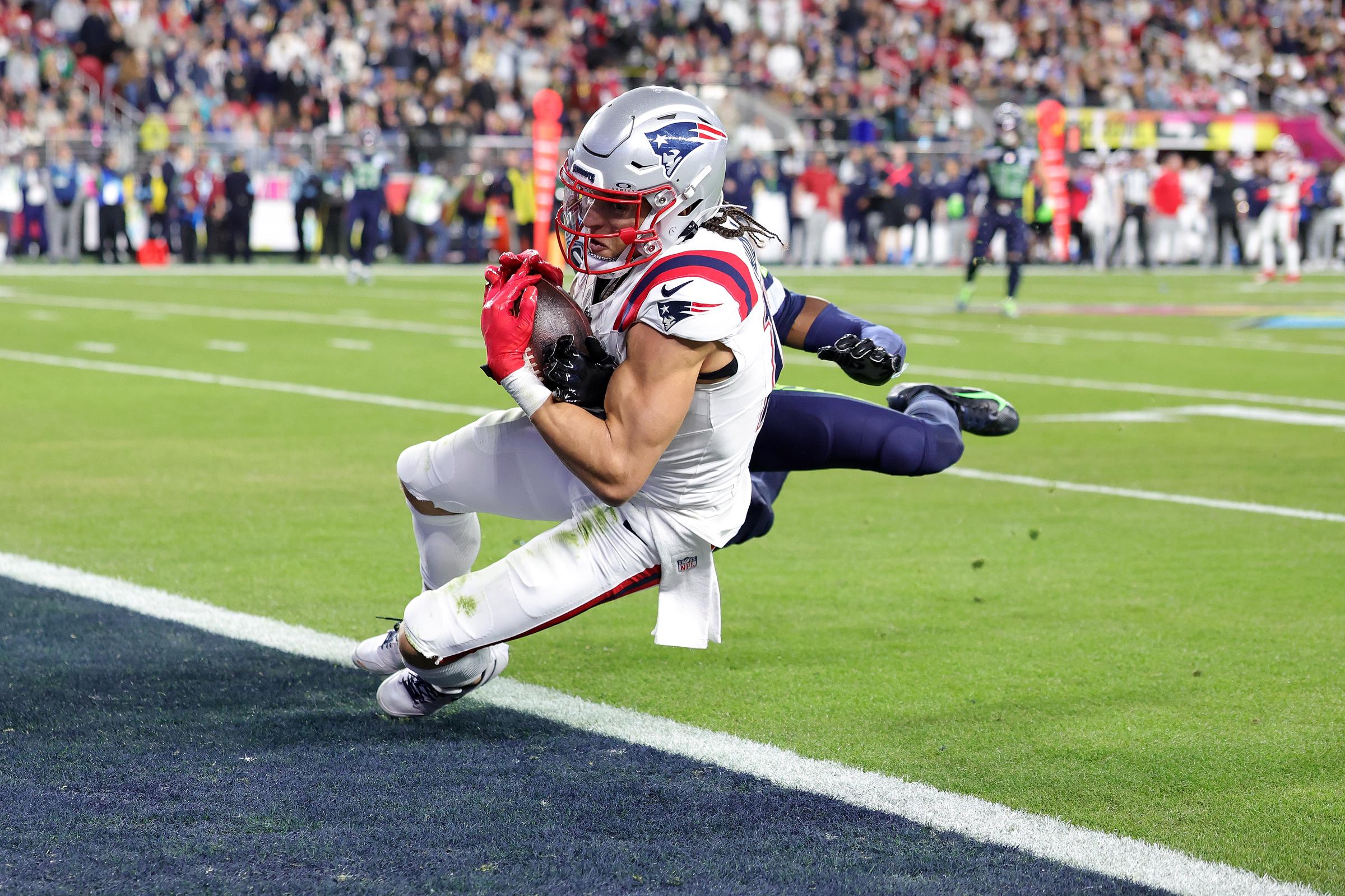 New England Patriots wide receiver Mack Hollins scores a touchdown against Seattle Seahawks cornerback Riq Woolen during Super Bowl LX | Source: Getty Images