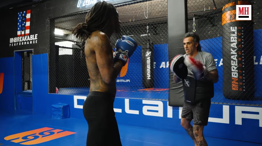 Wiz Khalifa sharpens his technique and footwork during a boxing session featured in the workout video. | Source: YouTube/Men's Health