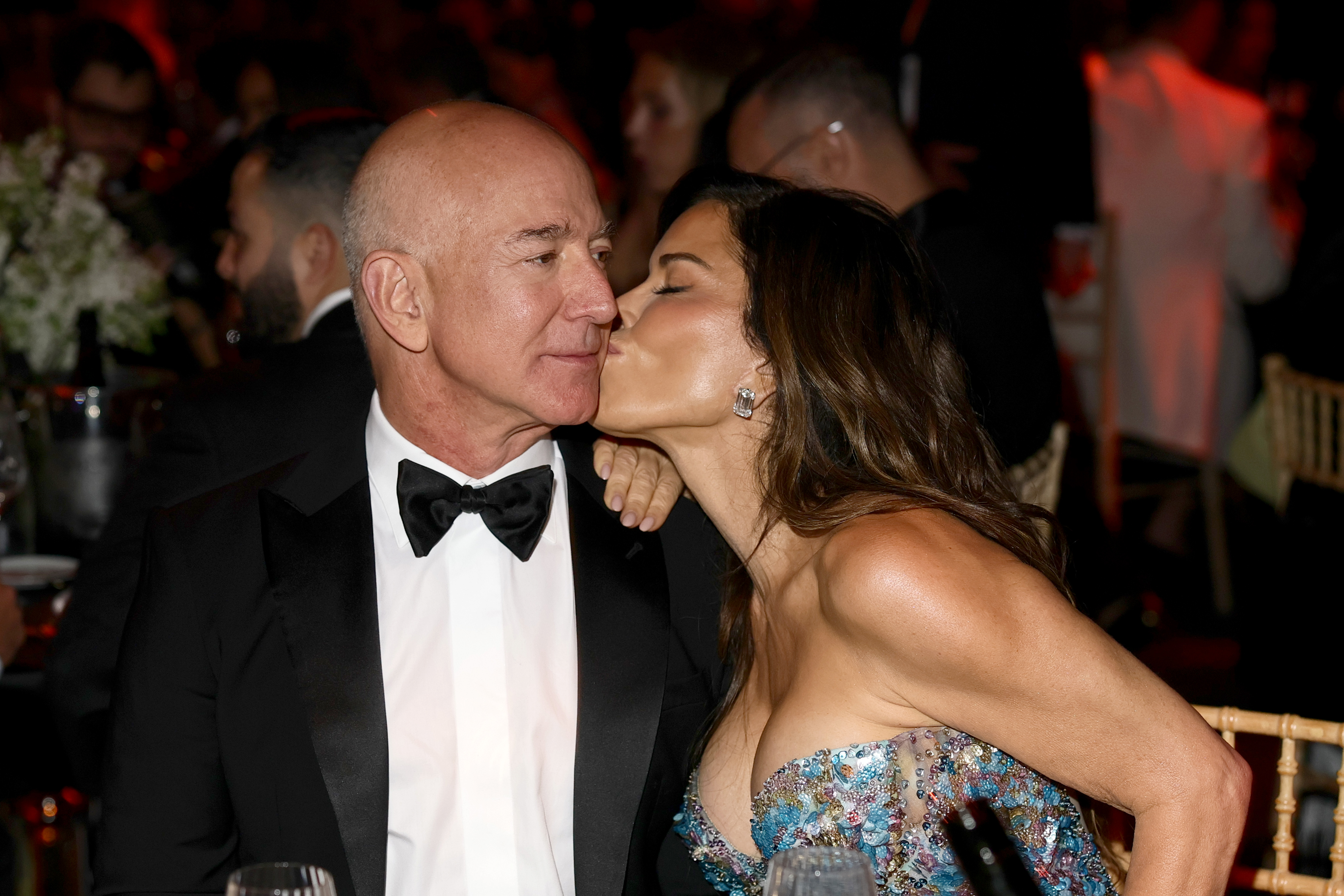 Lauren Sanchez kisses Jeff Bezos on the cheek at the amfAR gala on May 22, 2025, in Cap d'Antibes, France | Source: Getty Images