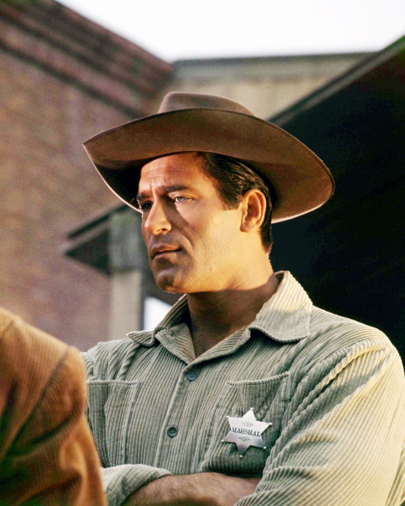 American actor Clint Walker wearing a marshall's badge and a cowboy hat, circa 1960. | Photo: Getty Images