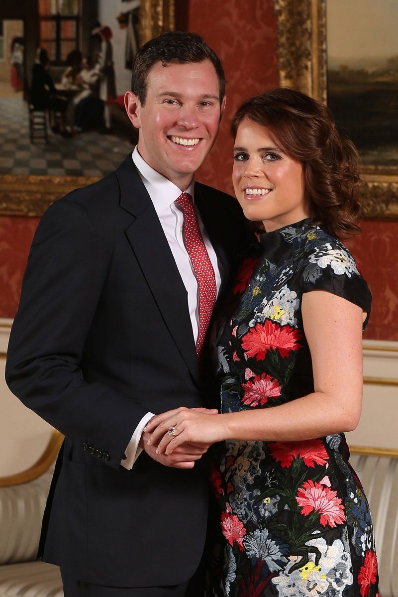 Princess Eugenie and Jack Brooksbank posing at the Picture Gallery at Buckingham Palace after they announced their engagement in London, England, in January 2018. | Image: Getty Images.