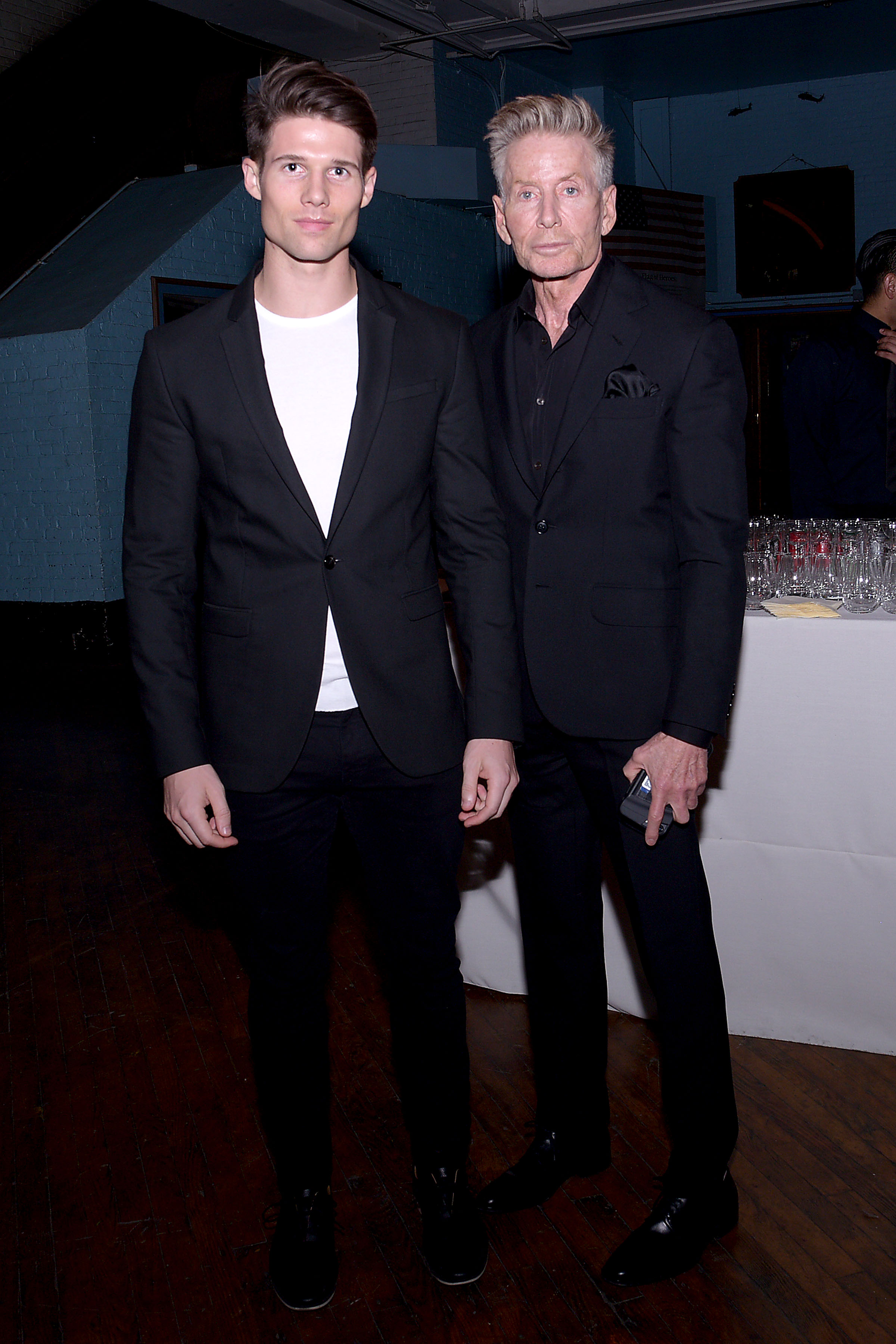 Kevin Baker and Calvin Klein posed together at the ACRIA Holiday Dinner held at The 69th Regiment Armory in New York City on December 7, 2016. Making one of their earliest public appearances as a couple, the pair matched in sleek black ensembles, presenting a united front at the event honouring The Robert Mapplethorpe Foundation, Judith Light, and Casey Fremont.