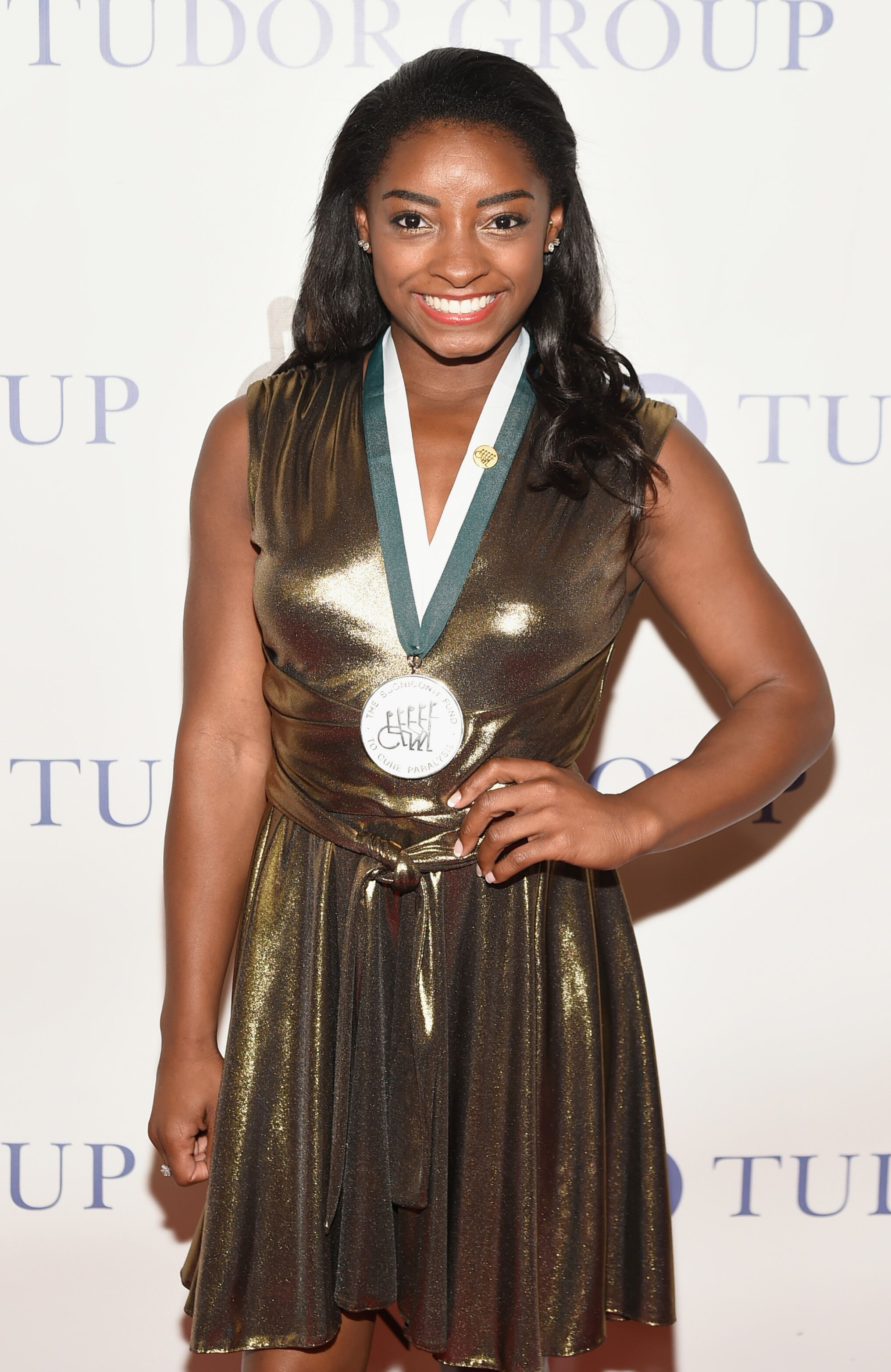 Simone Biles Shows Chest Piercing in Plunging White Top and Poses with