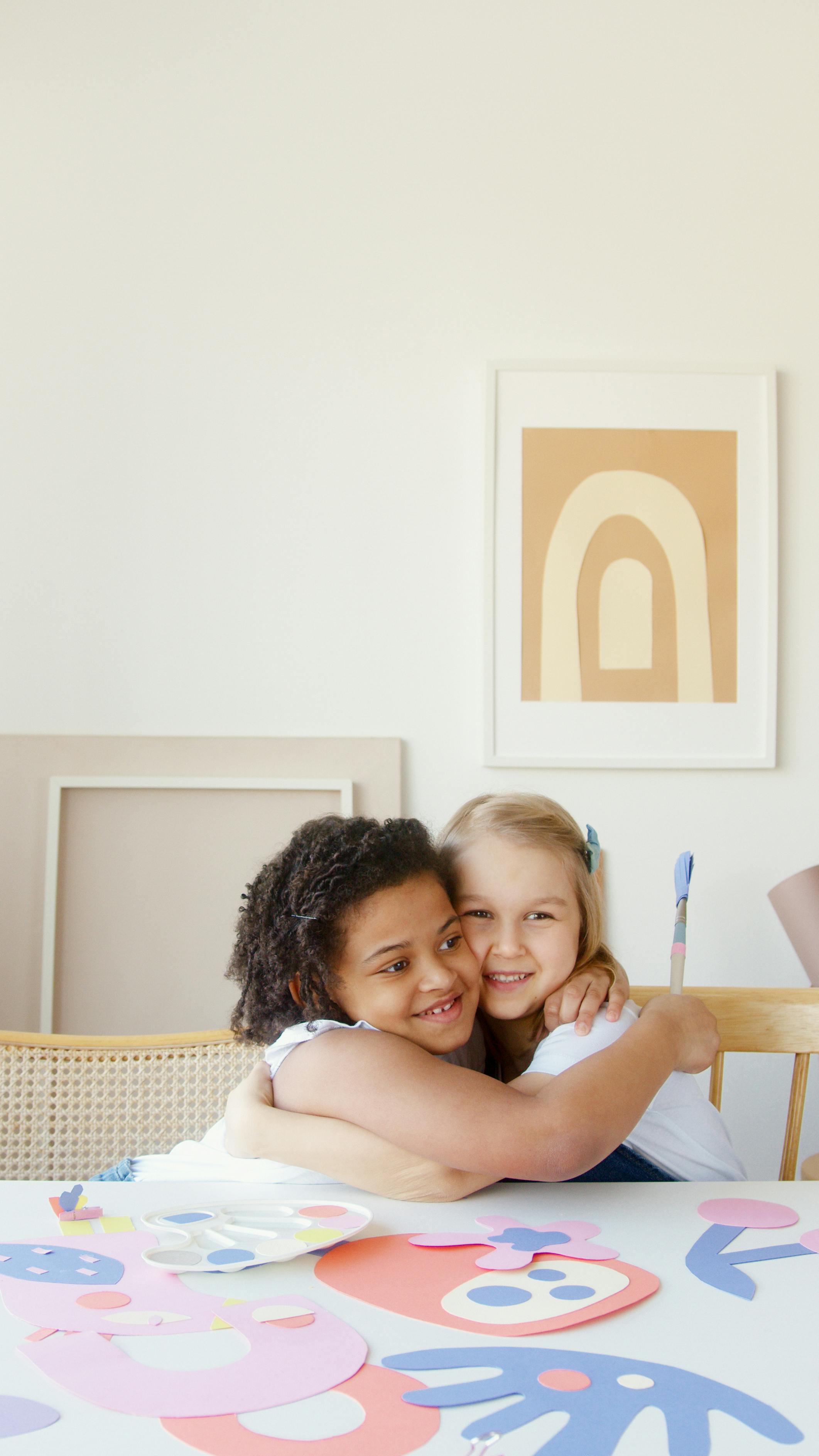 A happy little girl hugging her friend | Source: Pexels