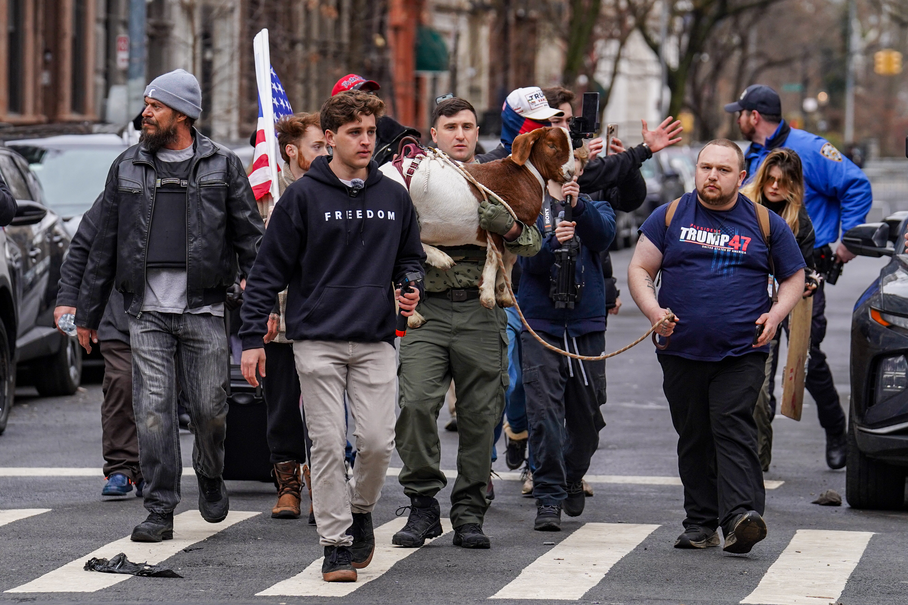 Right-wing influencer Jake Lang and other right-wing protestors seen protesting in New York on March 7, 2026. | Source: Getty Images