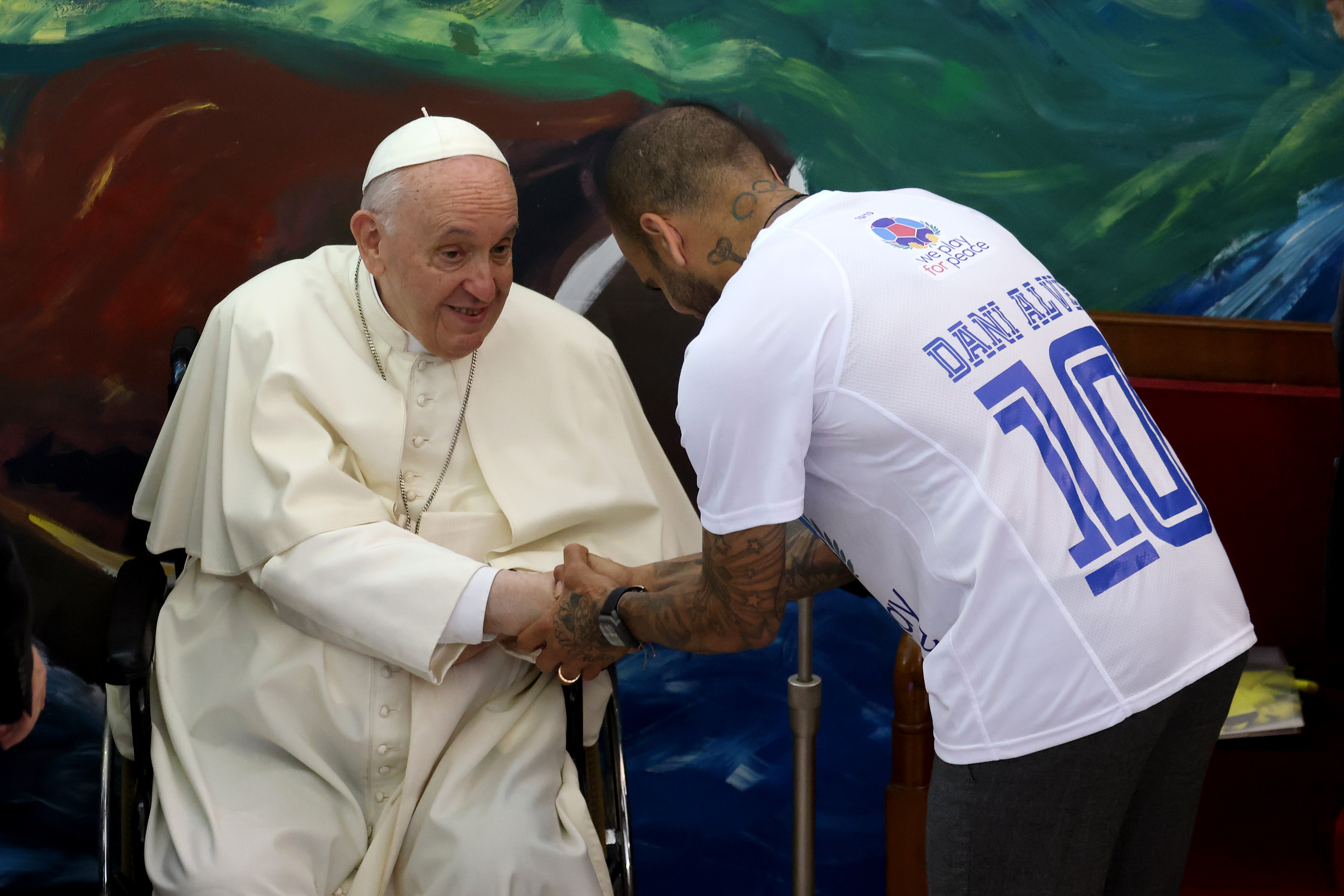 Pope Francis greeting soccer player Dani Alves during the launch of the Scholas Occurrentes International Movement at the Pontifical Urban University on May 19, 2022, in Vatican City, Vatican. | Source: Getty Images