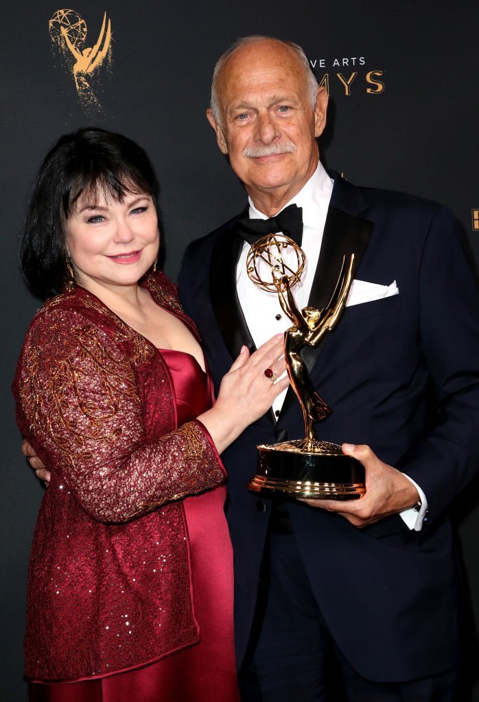 Delta Burke, (L) and actor Gerald McRaney pose in the press room with the award for outstanding guest actor in a drama series for "This is Us" at the 2017 Creative Arts Emmy Awards | Getty Images