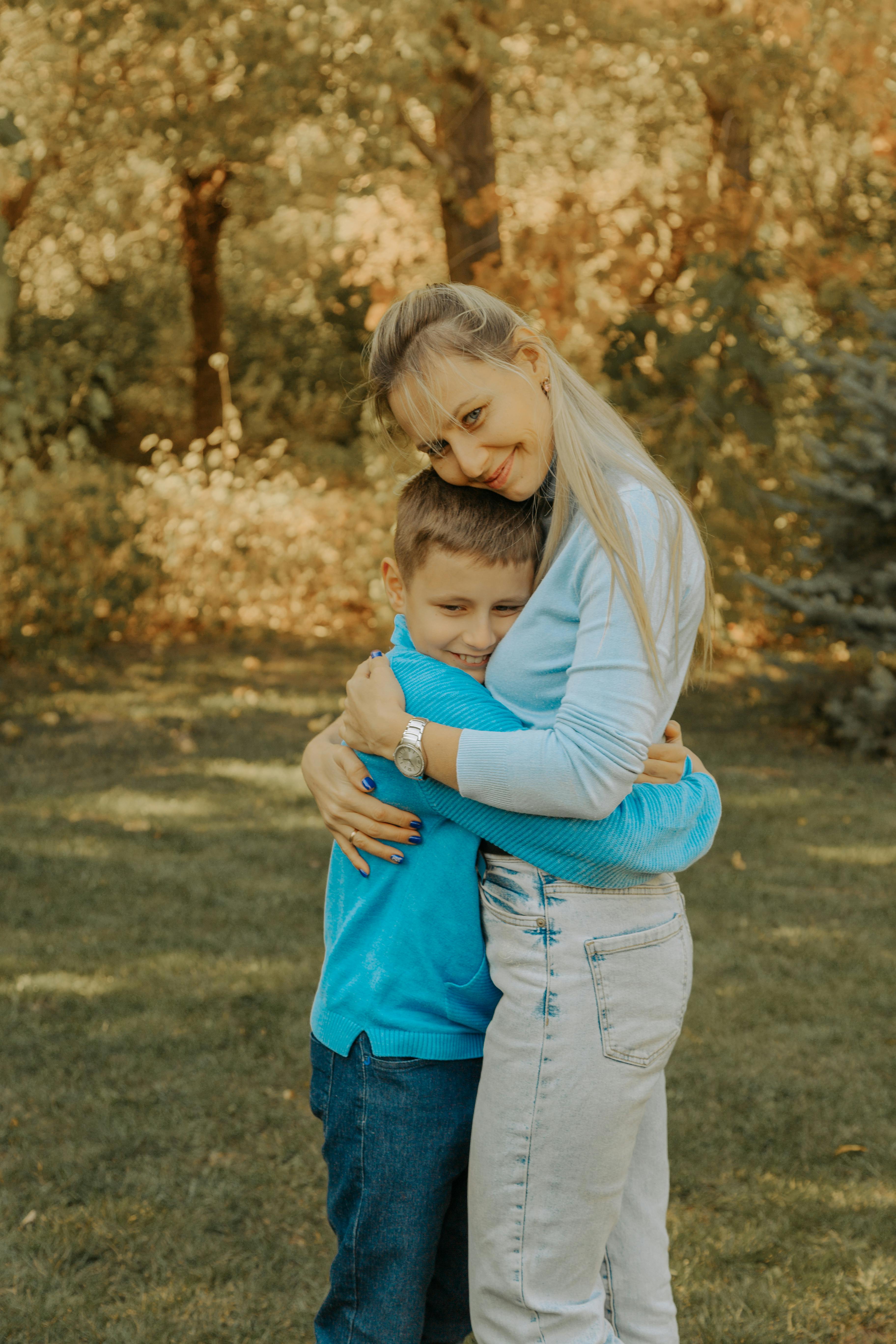 A mom hugging her son | Source: Pexels