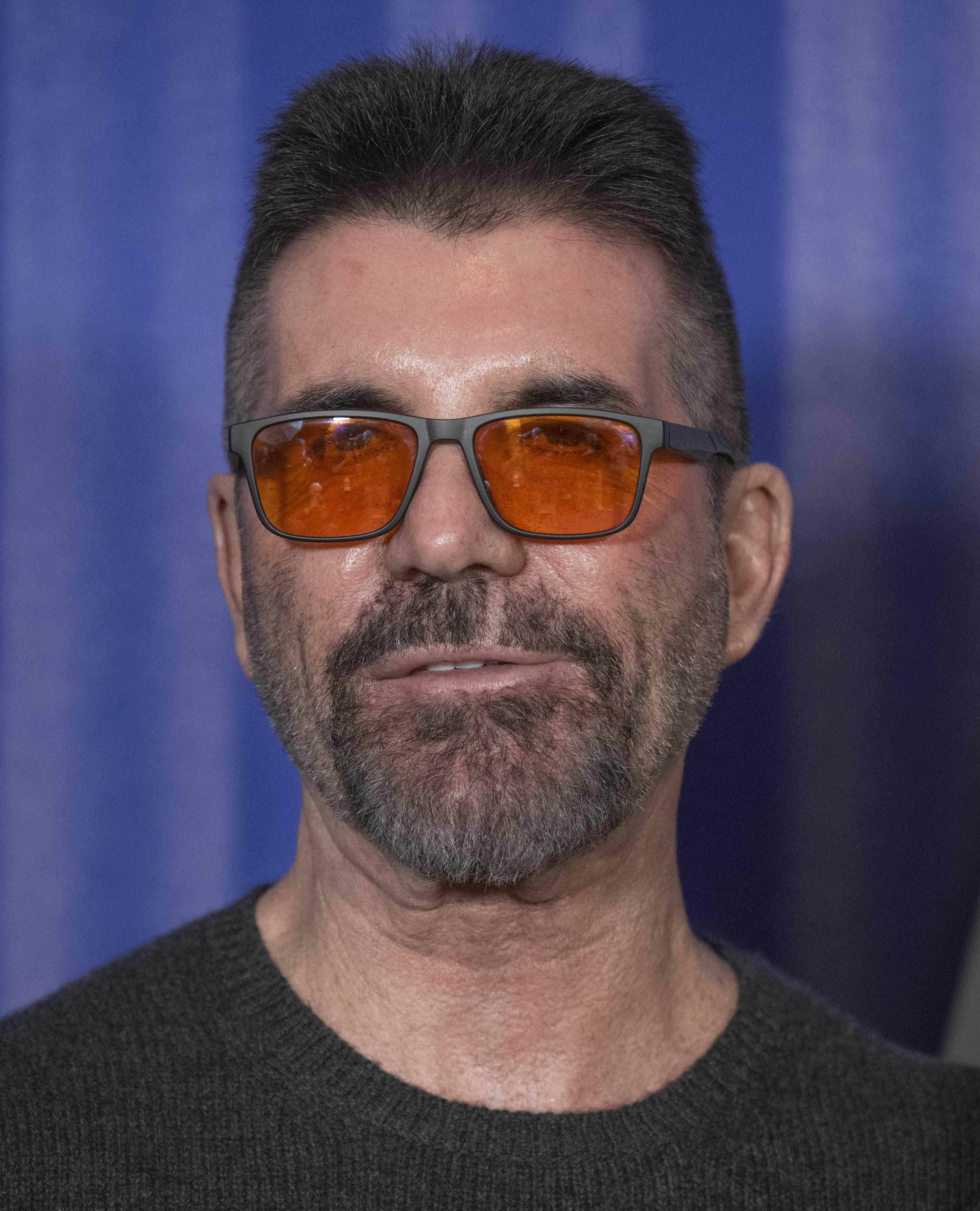 Simon Cowell showing off his face at his show's press launch on February 12, 2025, in London, England | Source: Getty Images