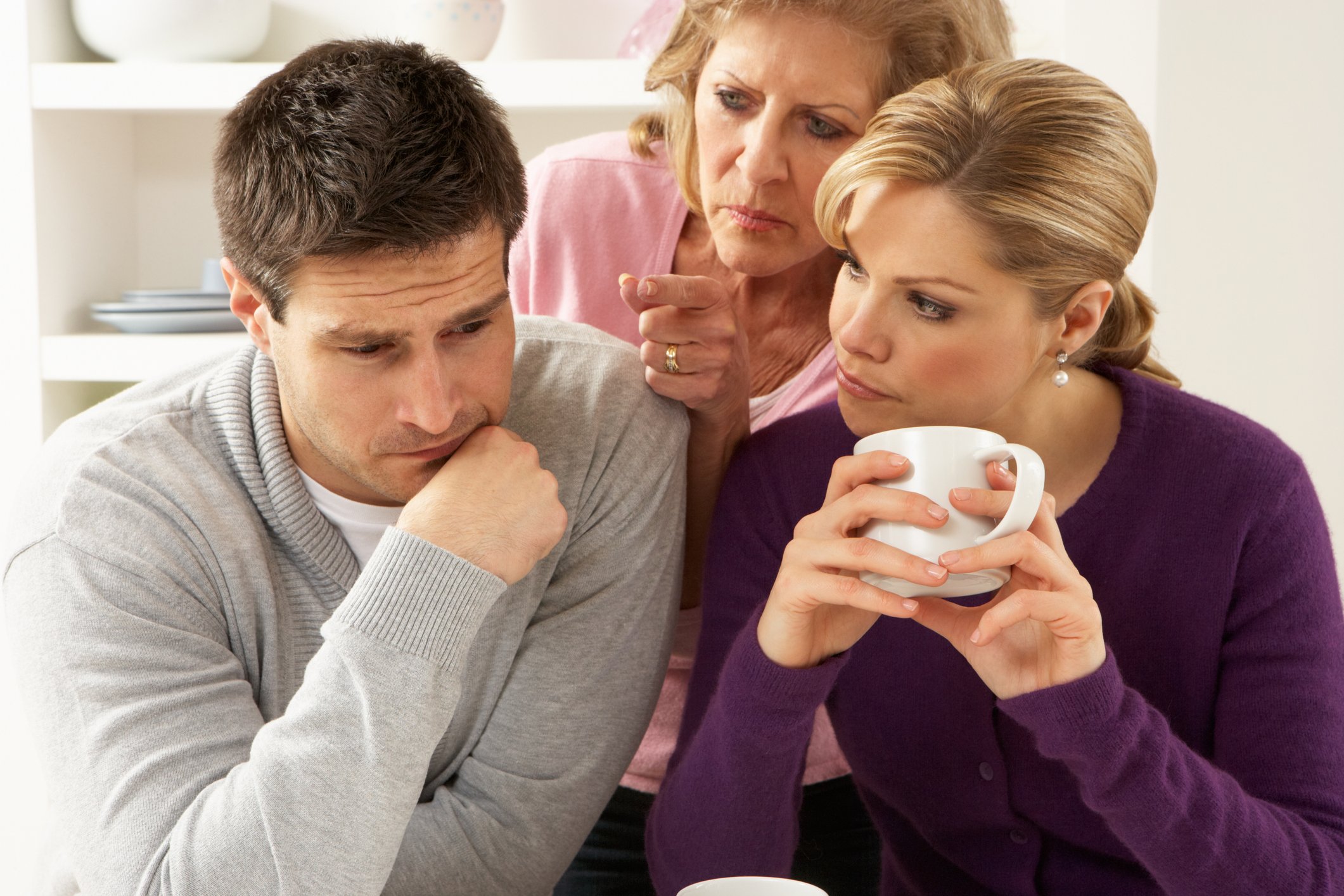 Older woman interferes in a couple's conversation | Photo: Getty Images