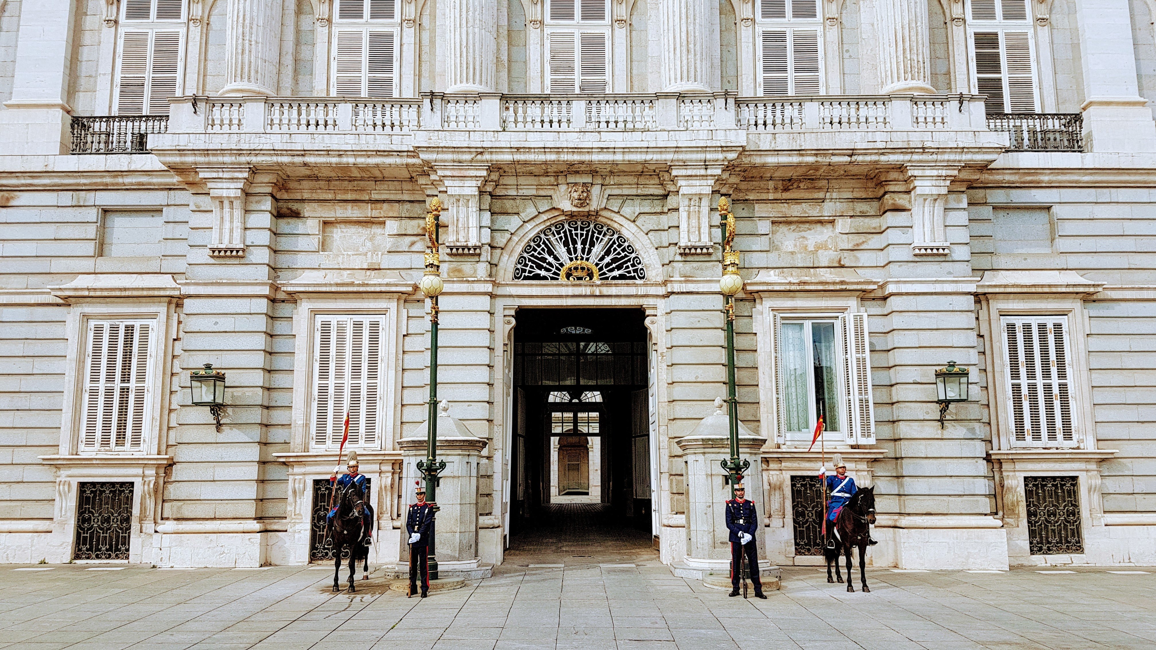 Pictured - Guards standing outside a building with horses | Source: Pexels 