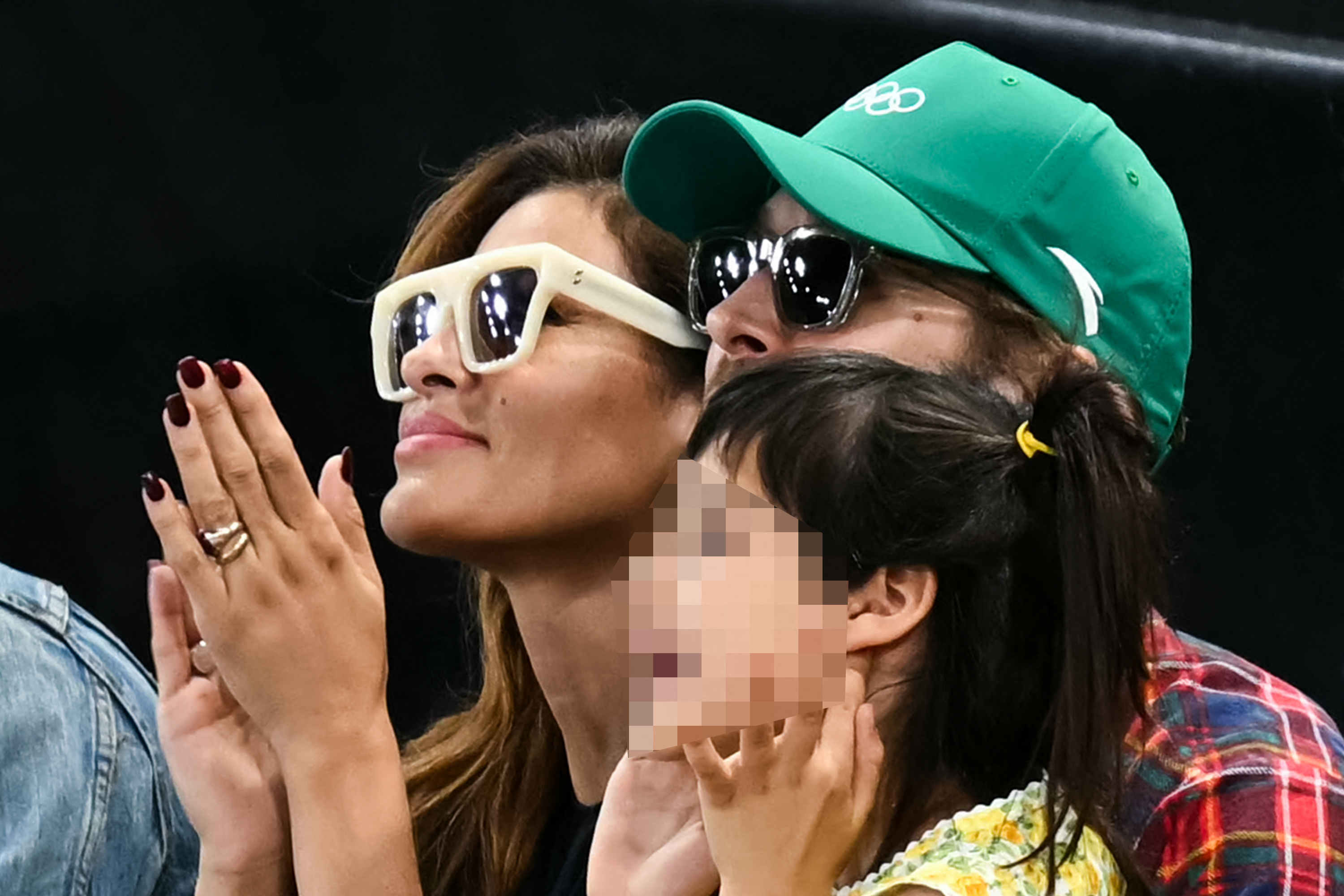 Eva Mendes and Ryan Gosling watching the women’s uneven bars final at the Bercy Arena during the 2024 Paris Olympics on August 4, 2024 | Source: Getty Images