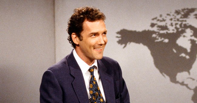 A portrait of Norm MacDonald smiling during anchoring duties | Photo: Getty Images