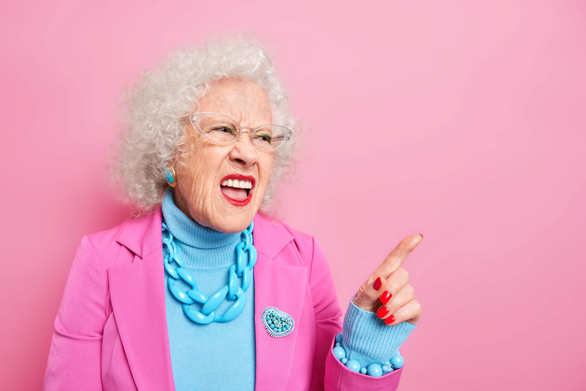 An annoyed elderly woman | Source: Freepik