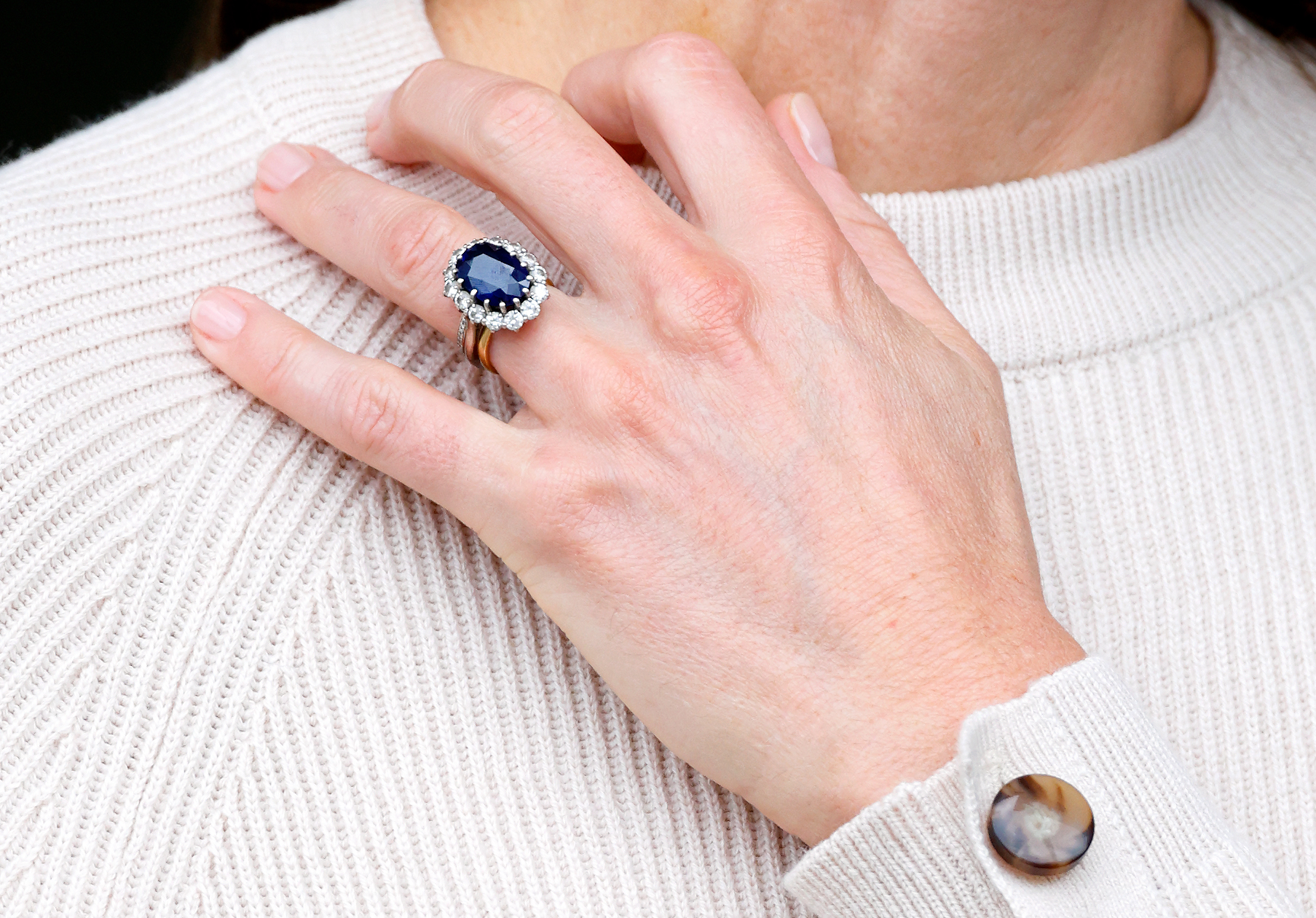 A close-up of Princess Catherine's engagement and wedding rings during her visit to Nottingham Trent University as part of World Mental Health Day in Nottingham, England on October 11, 2023 | Source: Getty Images