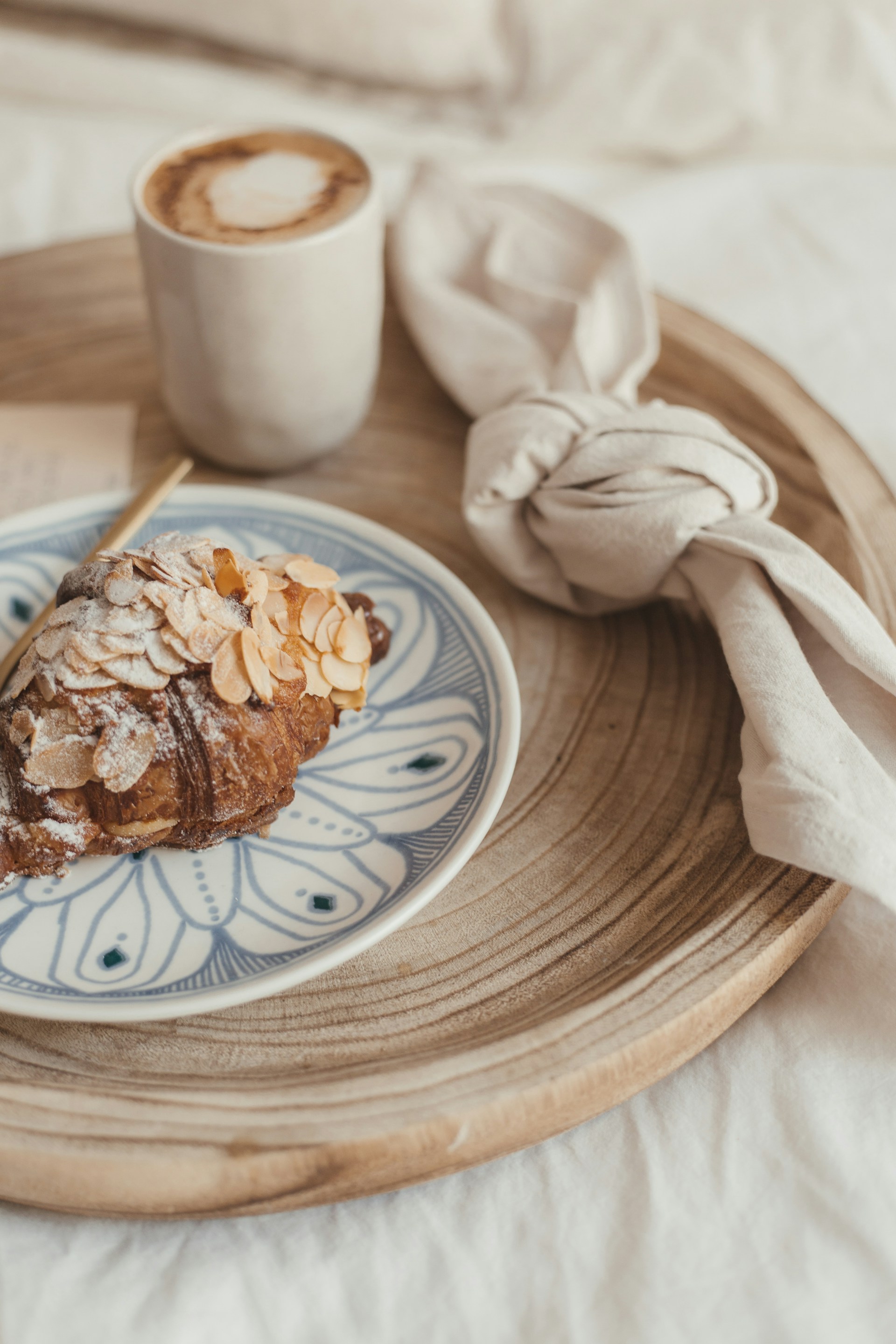A croissant and coffee on a table | Source: Unsplash