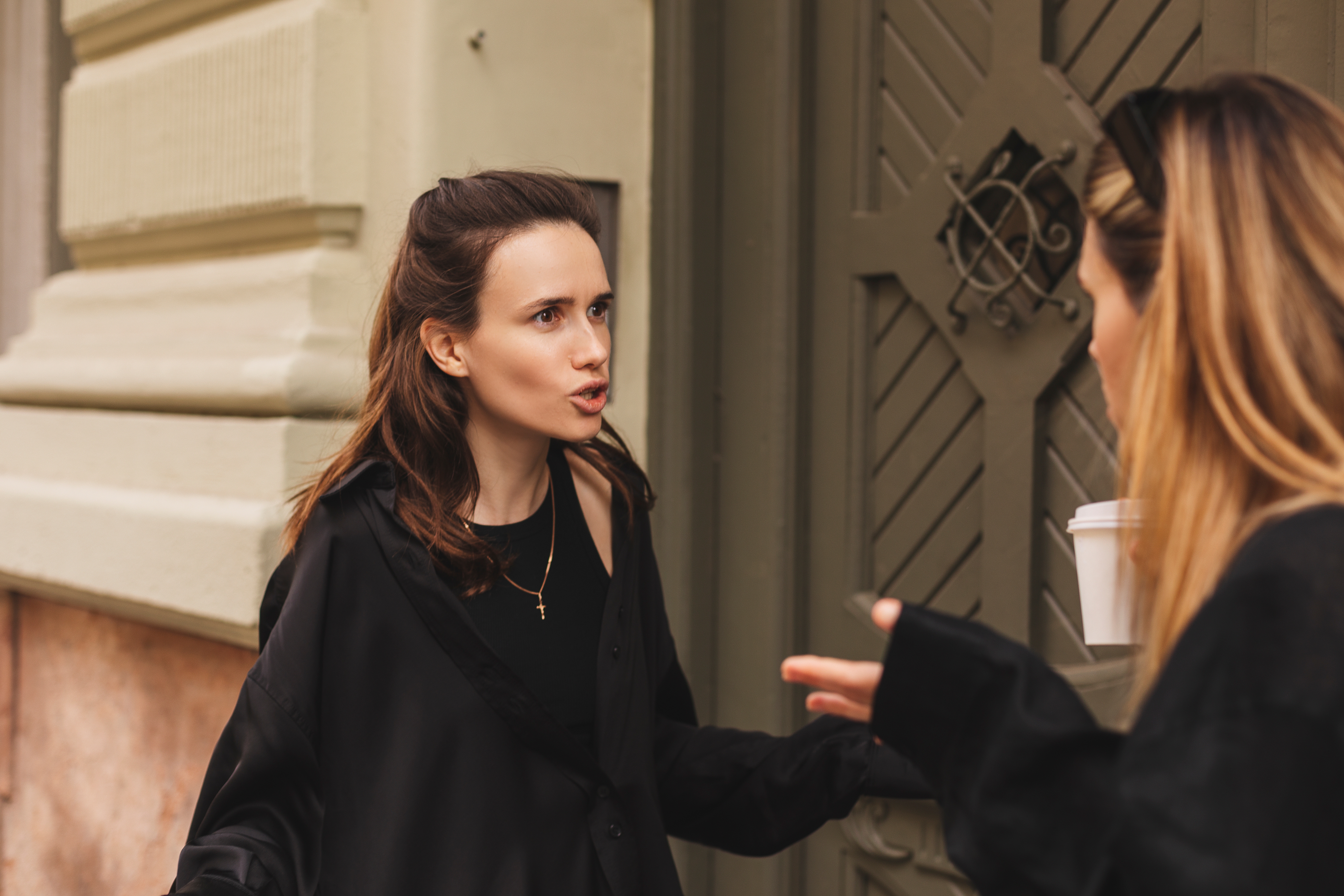 Two women having a heated conversation | Source: Shutterstock