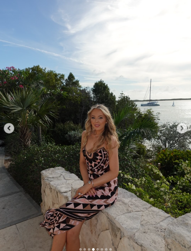 Tiffany Trump poses on a stone wall overlooking the water during Donald Trump Jr.’s wedding weekend in the Bahamas. | Source: Instagram/tiffanytrump