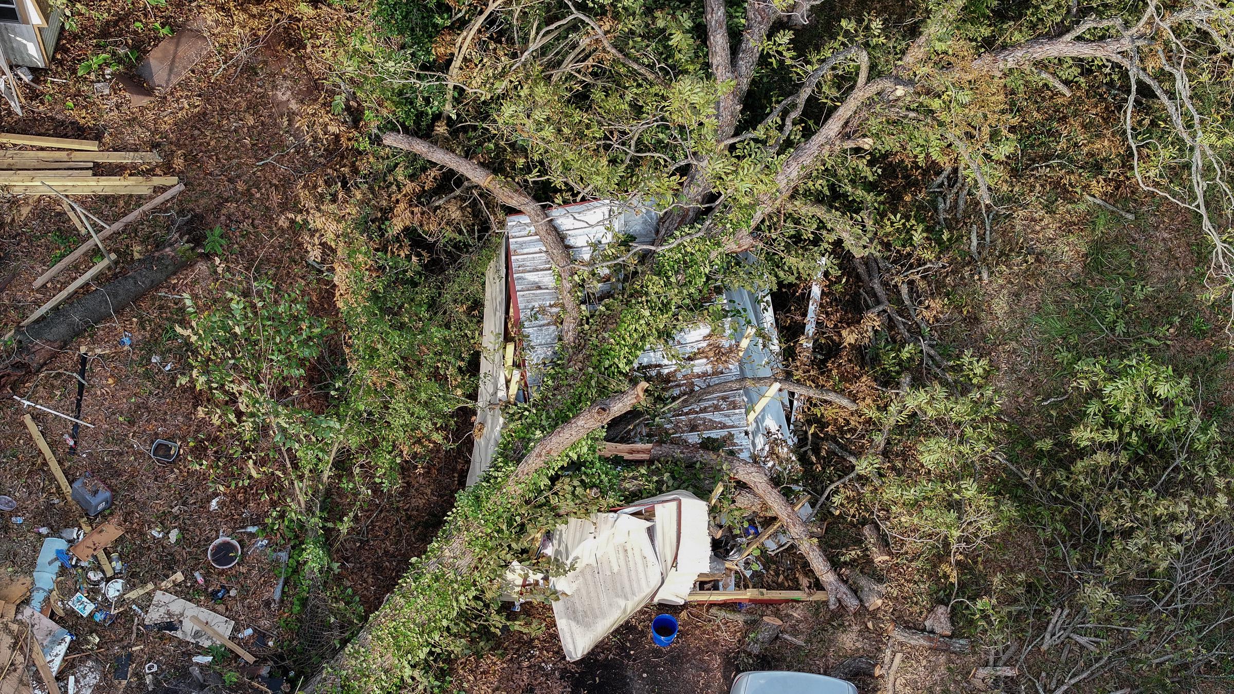 A tree lays on top of a shed as the area recovers from the aftermath of Hurricane Helene in Augusta, Georgia, on October 5, 2024 | Source: Getty Images