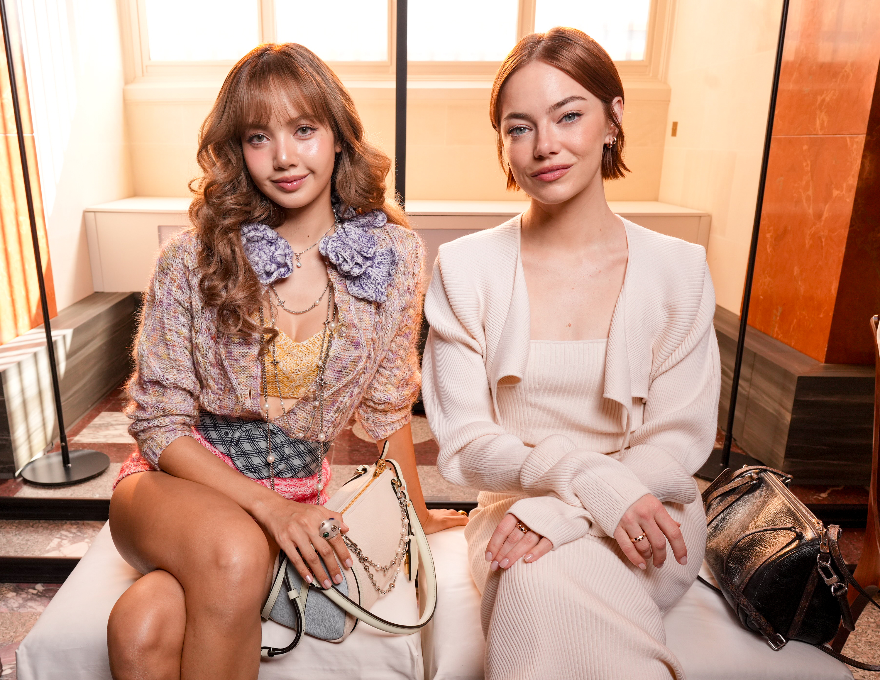 Lisa, Emma Stone at the Louis Vuitton fashion show as part of Spring/Summer 2026 Paris Fashion Week held at The Louvre on September 30, 2025 in Paris, France. | Source: Getty Images