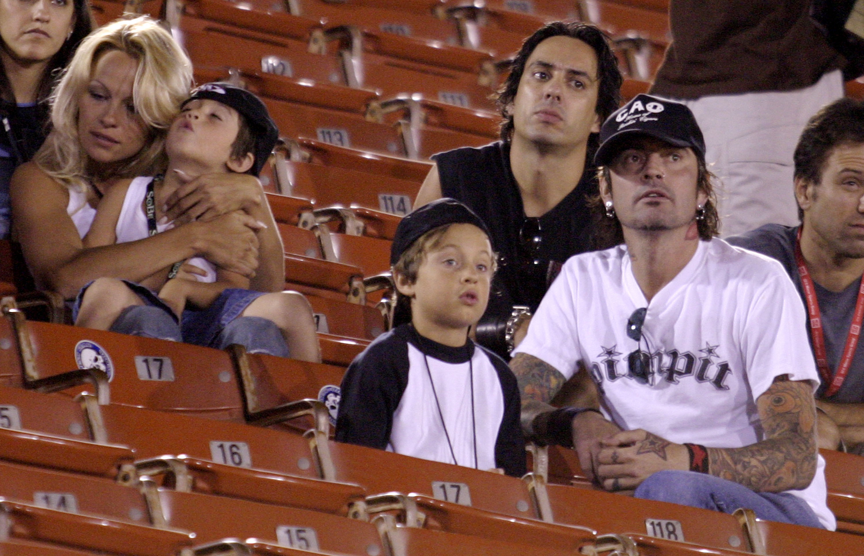 Pamela Anderson and Tommy Lee with Brandon and Dylan watching the X Games - Moto X Freestyle competition at the AL Coliseum in Los Angeles, California  on August 16, 2003 | Source: Getty Images