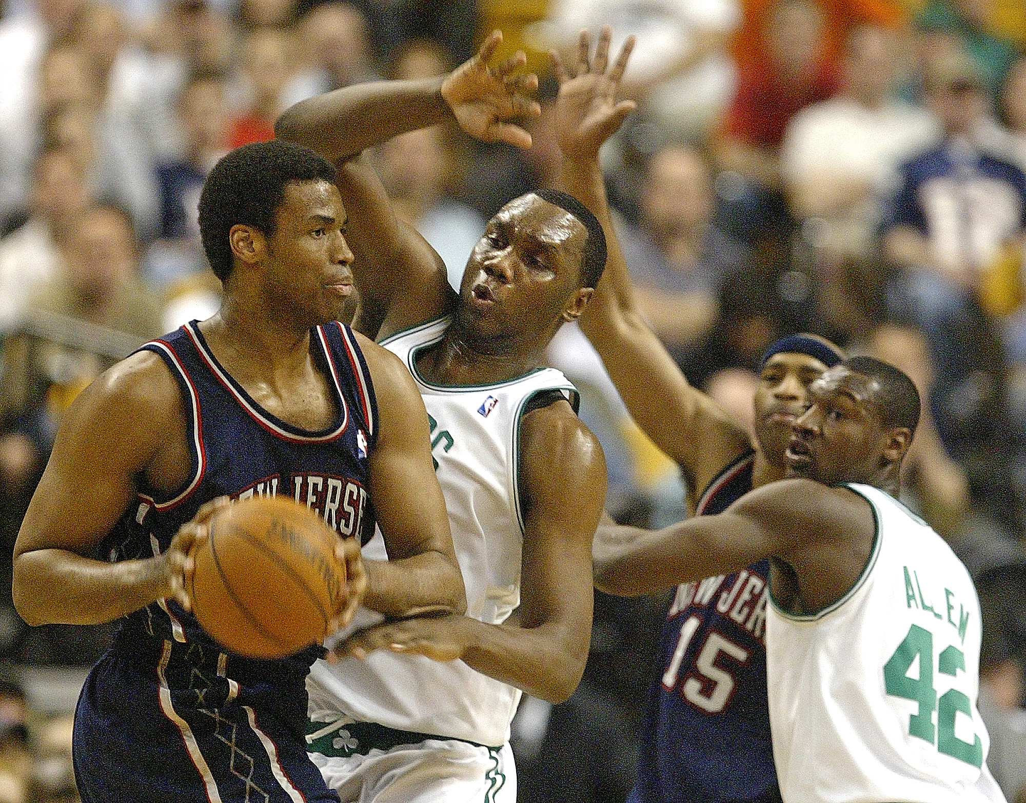 Al Jefferson puts pressure on Jason Collins as Tony Allen guards Vince Carter during the Boston Celtics vs. New Jersey Nets game at the Boston Garden on April 20, 2005, in Boston, Massachusetts | Source: Getty Images