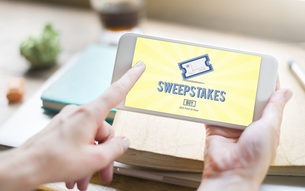 An online sweepstakes application open on a phone. | Source: Shutterstock