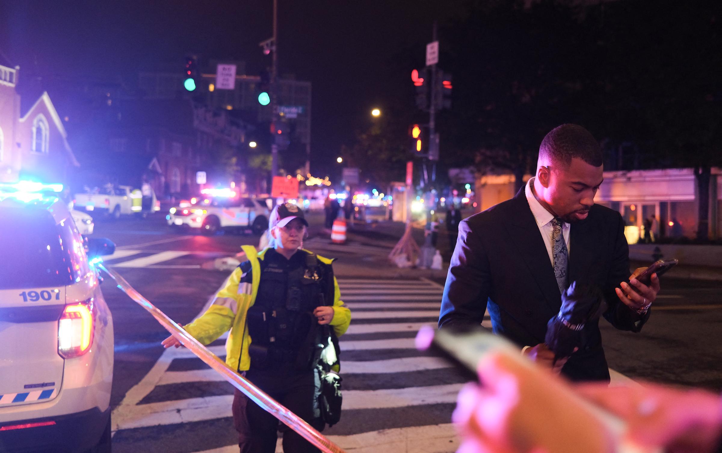 Guests walk away from the Washington Hilton amid a heavy police presence after shots were heard during the White House Correspondents' Dinner in Washington, DC, on April 25, 2026 | Source: Getty Images