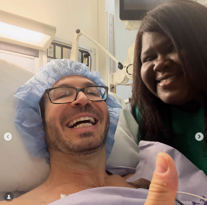 Brandon Frankel and Gabourey Sidibe taking a selfie from a hospital bed, from a post dated February 20, 2026 | Source: Instagram/brandontour