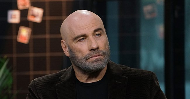 John Travolta looking sad during an interview. | Source: Getty Images