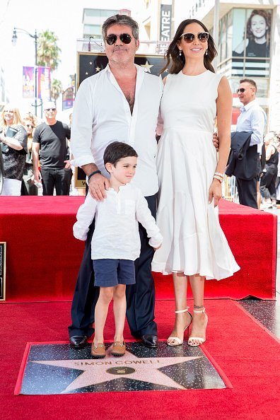 Simon Cowell, Lauren Silverman and Eric Cowell attend a ceremony honoring Cowell with a star on the Hollywood Walk of Fame on August 22, 2018, in Hollywood, California. | Source: Getty Images. 