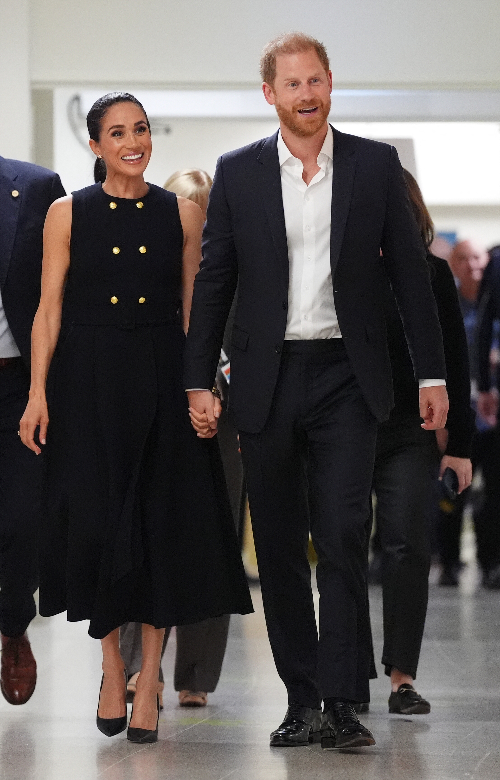Prince Harry and Meghan Markle walked hand-inhand through the Royal Children's Hospital , smiling as they continued their first engagement in Melbourne, Australia, on 14 April 2026. | Source: Getty Images