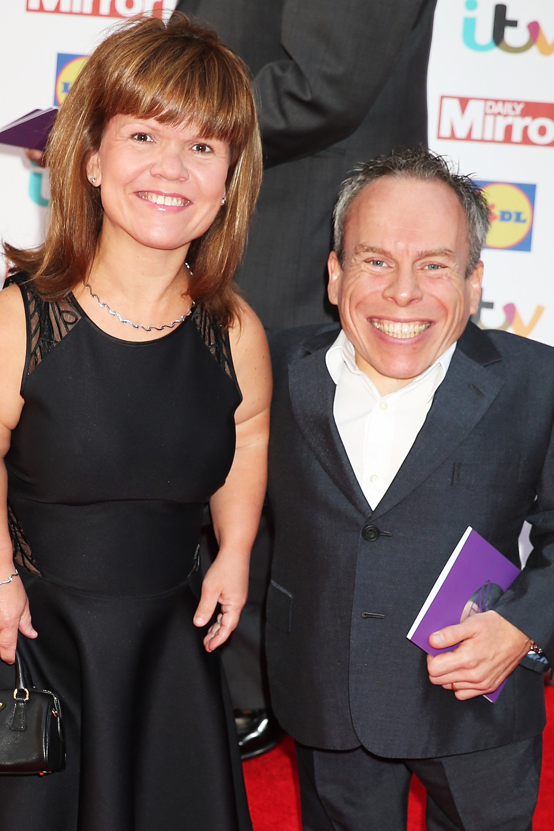 Warwick Davis (R) and Samantha Davis attend the Pride of Britain awards at The Grosvenor House Hotel on September 28, 2015 in London, England. | Source: Getty Images