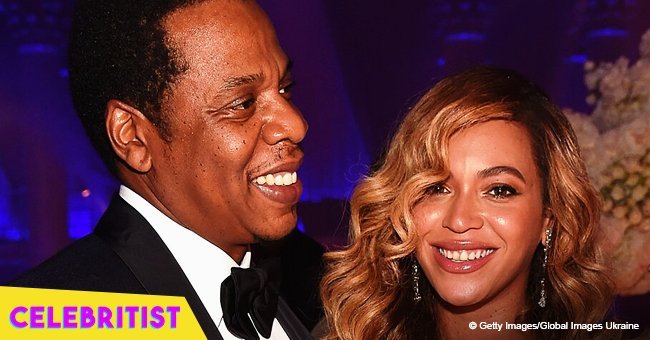 Beyoncé stuns in custom-made Versace ensemble sharing a hug on stage with Jay-Z in new photo 