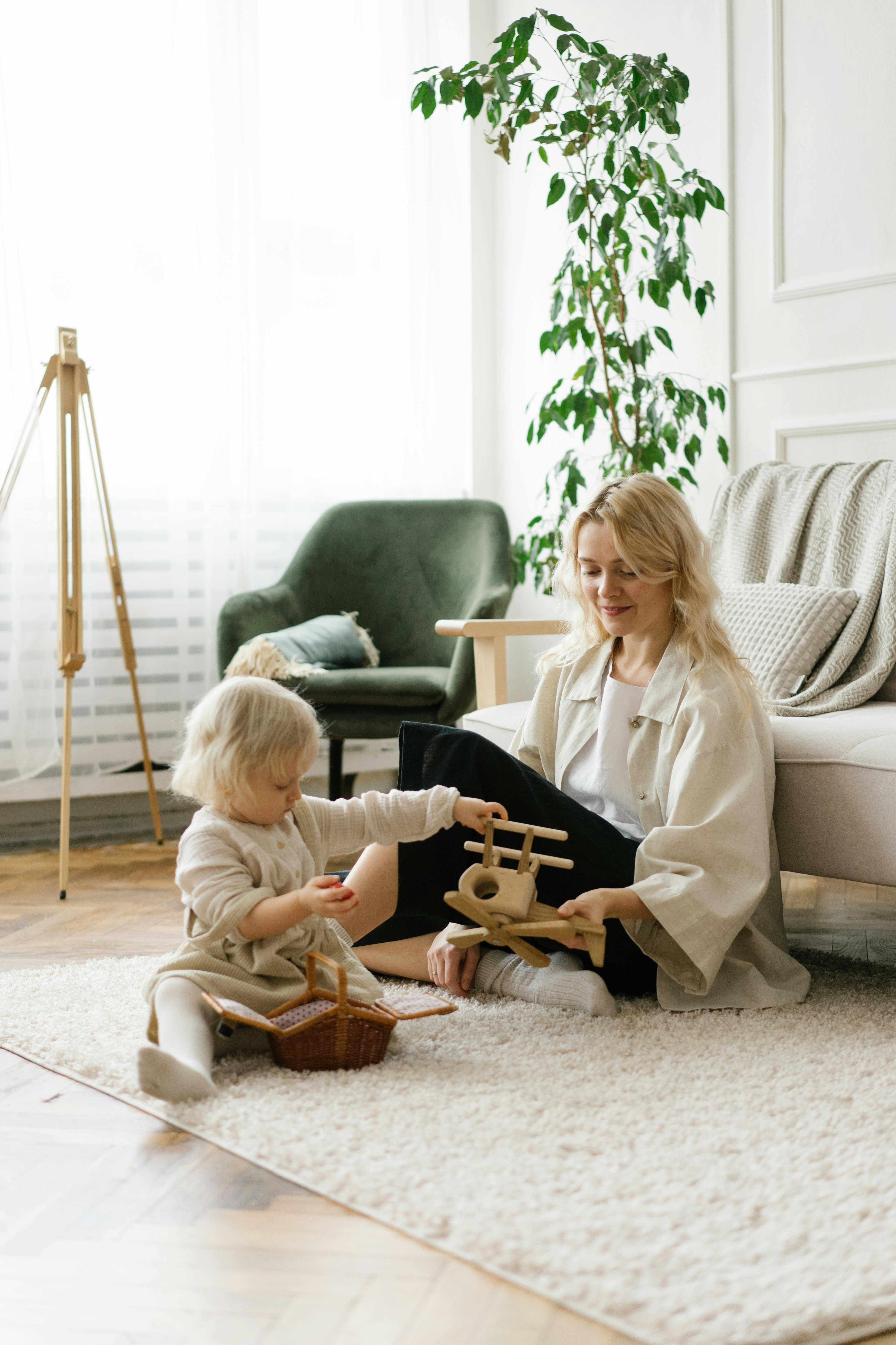 A woman playing with a child | Source: Pexels