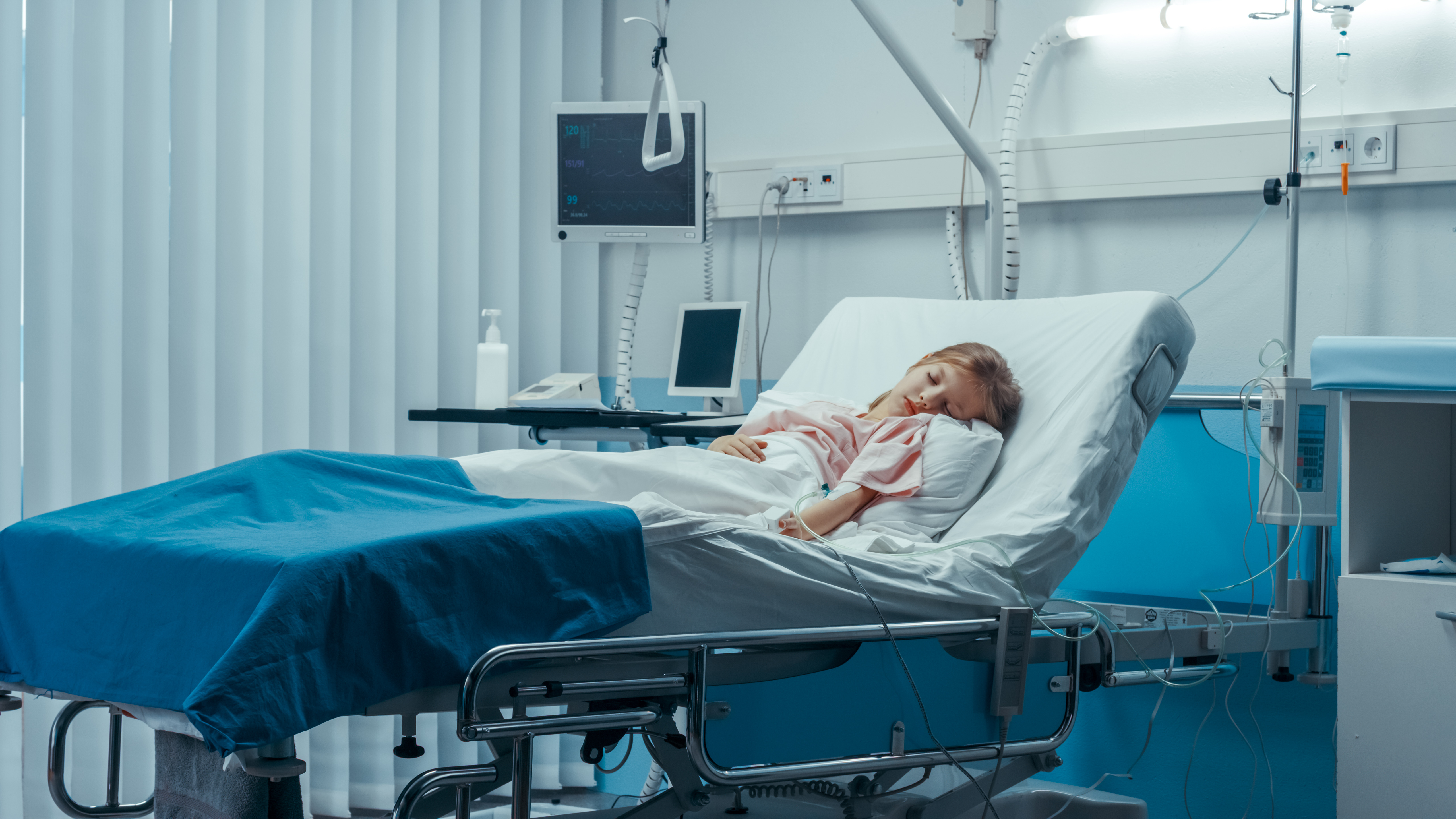 Sick girl sleeps on a bed in the children's hospital | Source: Shutterstock.com