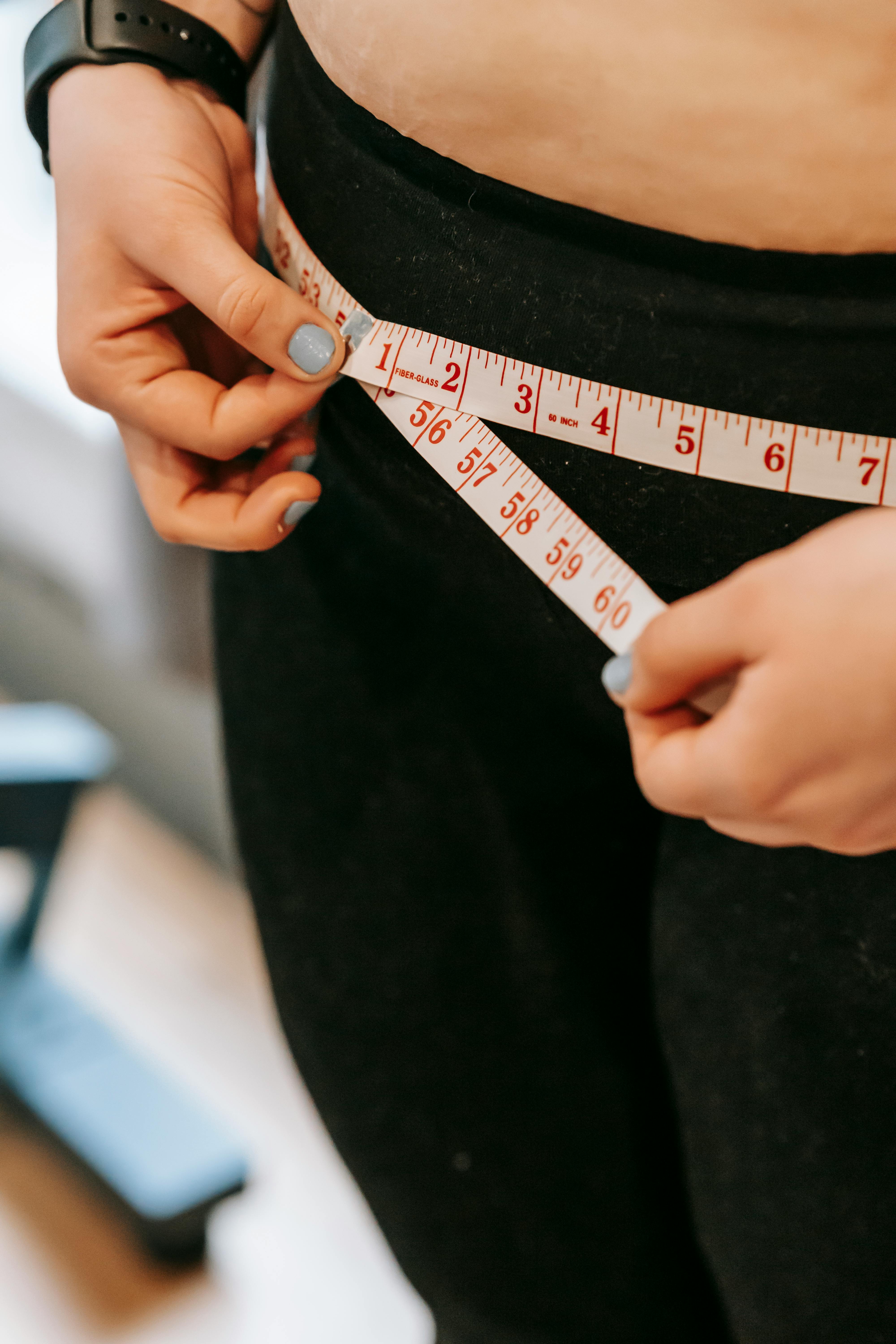 Woman with a tape measure | Source: Pexels