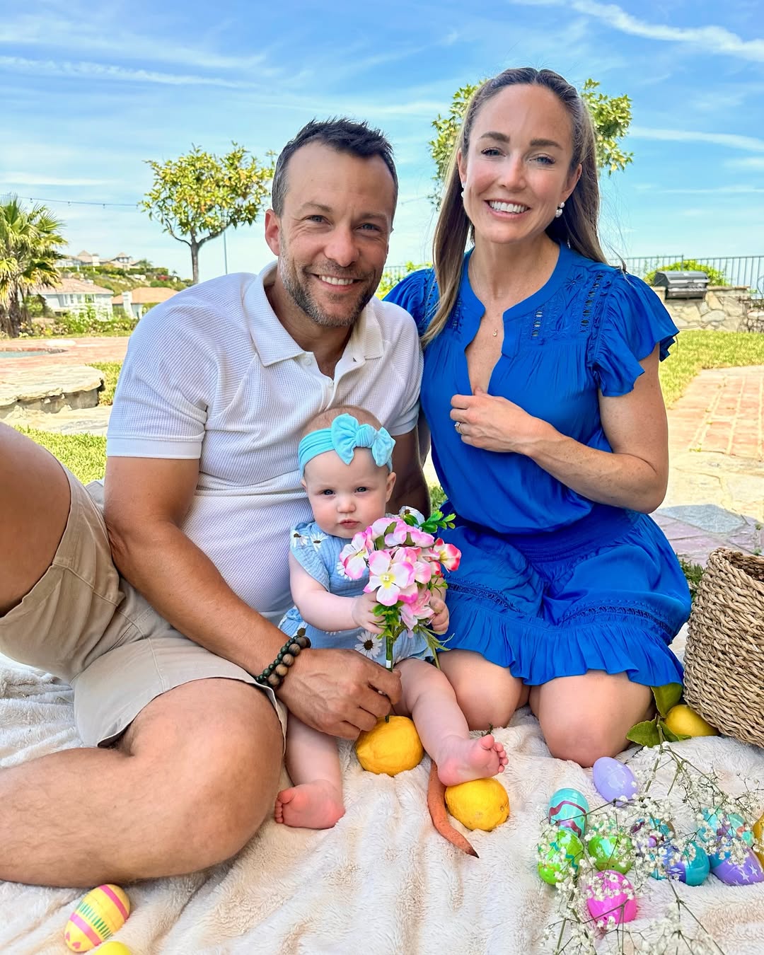 Caity Lotz and Kyle Schmid with their daughter from a post dated April 20, 2025. | Source: Instagram/caitylotz