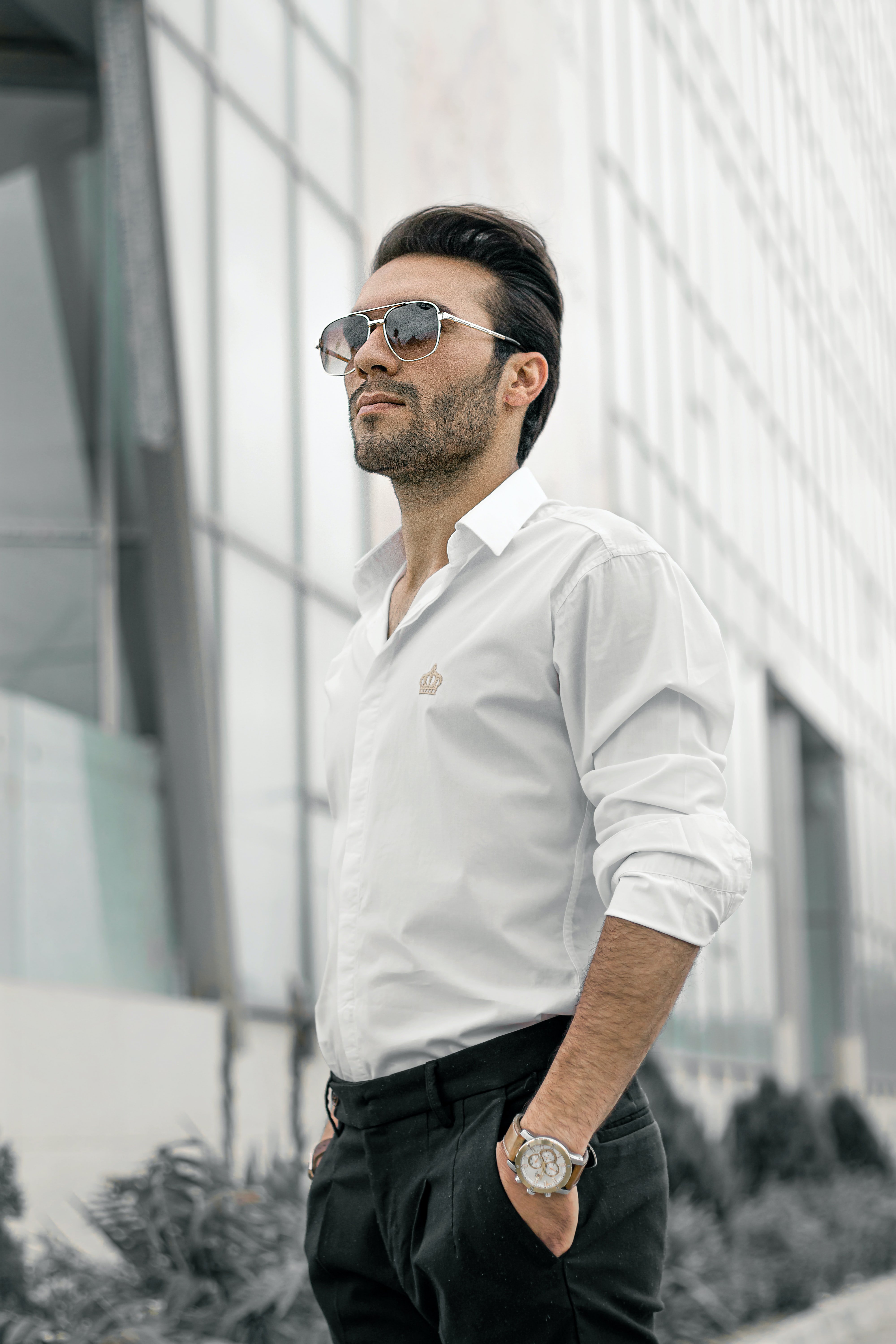 Man wearing sunglasses and a white shirt | Source: Unsplash / Mahdi Bafande
