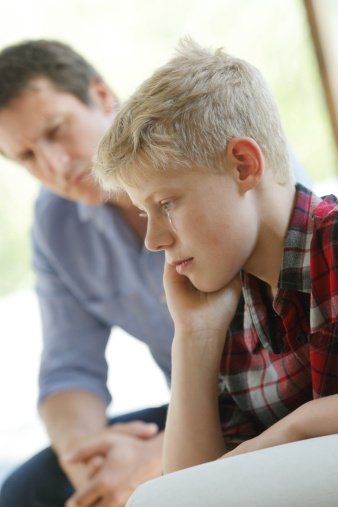 Photo of father talking to upset son | Photo: Getty Images