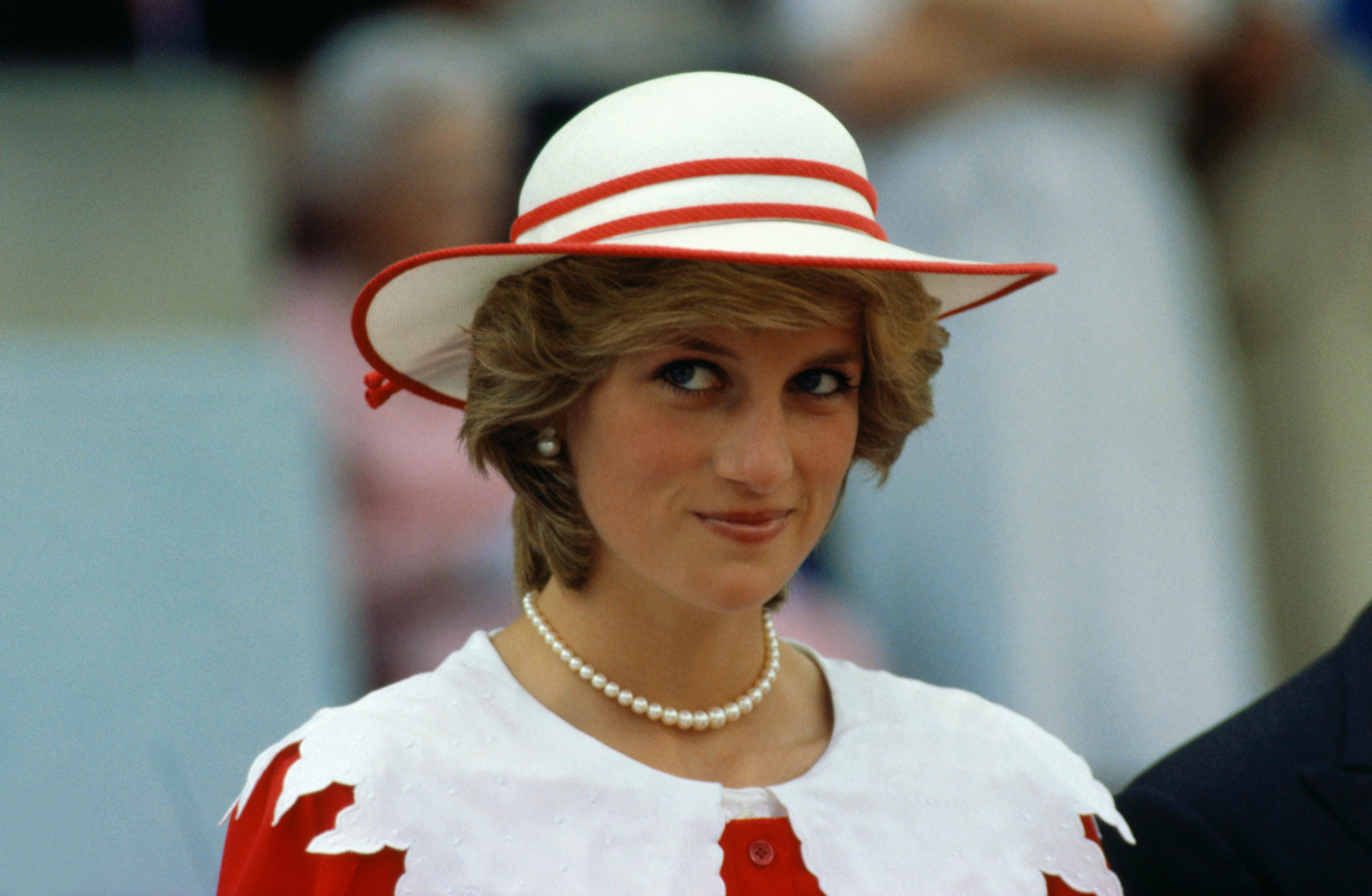 Diana, Princess of Wales wears an outfit in the colors of Canada during a State visit to Edmonton, Alberta with her husband.  July 29, 1983 |  Source: Getty Images 