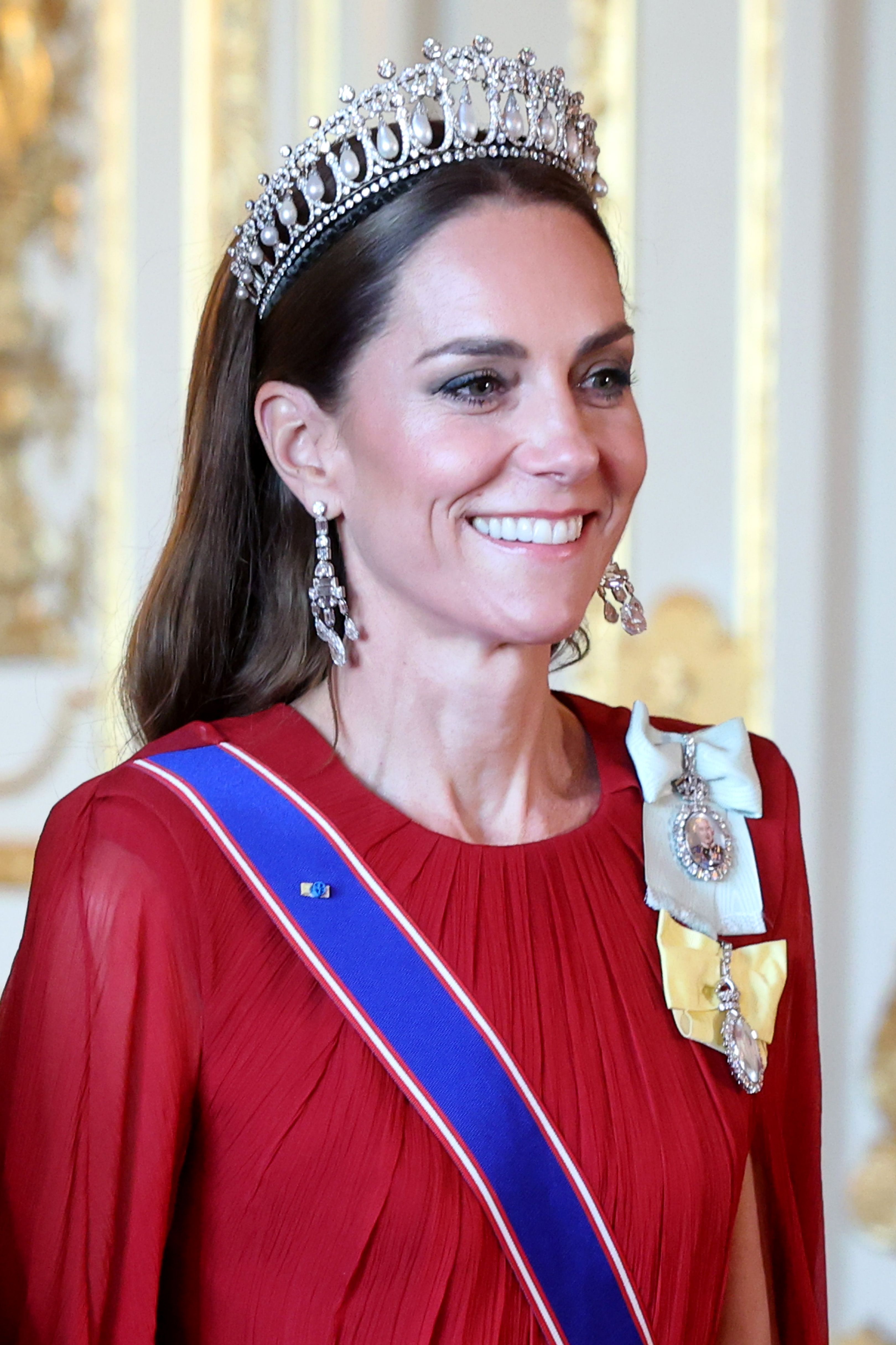 Princess Catherine wears Queen Mary's Lover's Knot Tiara, Greville Diamond Chandelier Earrings, and royal honors — including the Orders of Queen Elizabeth II and King Charles III — at the state banquet for President Emmanuel Macron and First Lady Brigitte Macron.