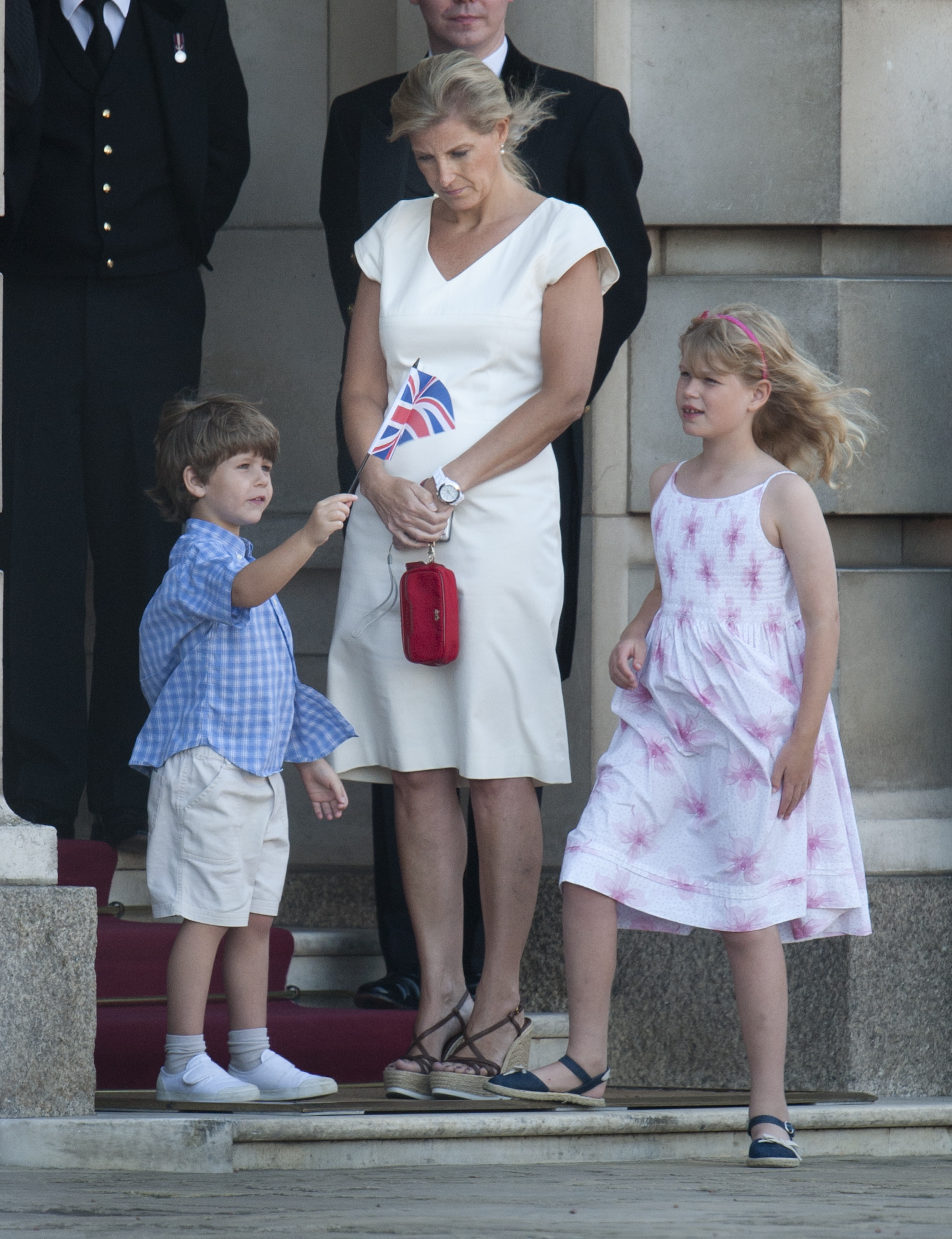 Excited and involved: Proudly waving the Union Jack, young James shares a patriotic moment with his sister Lady Louise and their mother Sophie during the 2012 Olympic Torch Relay. The family were photographed at Buckingham Palace as crowds gathered ahead of the London Games.
