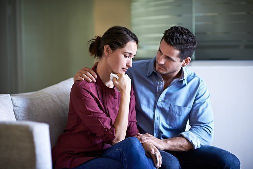 Husband and wife having a conversation, with the wife looking sad | Photo: Getty Images