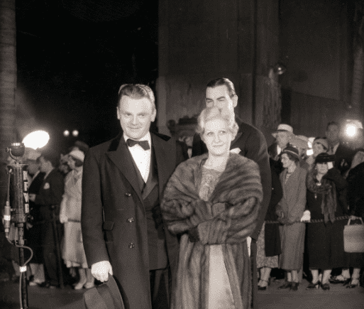 James Cagney with his wife, Frances Cagney posing for photographers before a black tie affair | Photo: Getty Images