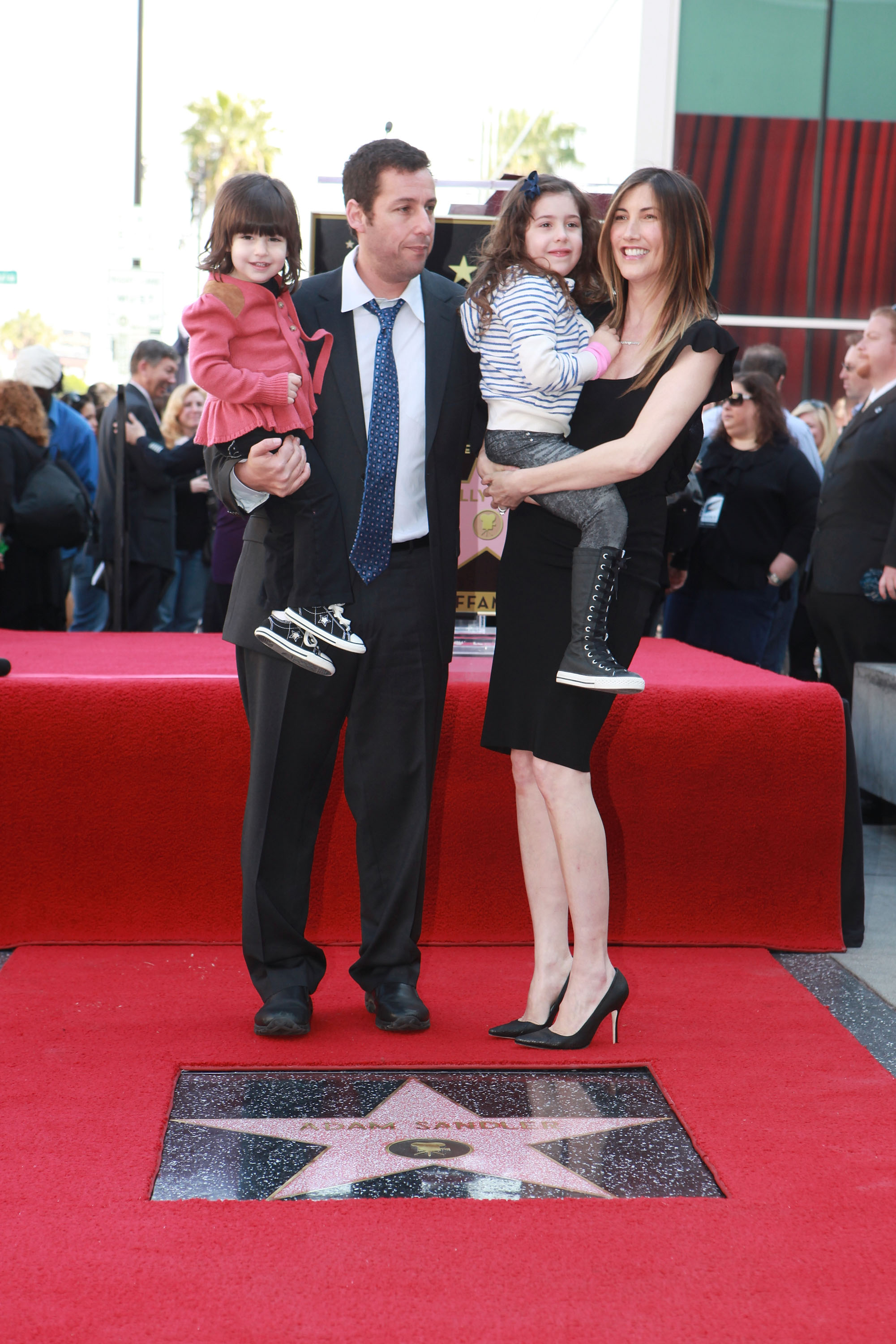 Adam with Jackie, Sadie, and Sunny Sandler at his Hollywood Walk of Fame Star Ceremony on February 1, 2011. | Source: Getty Images