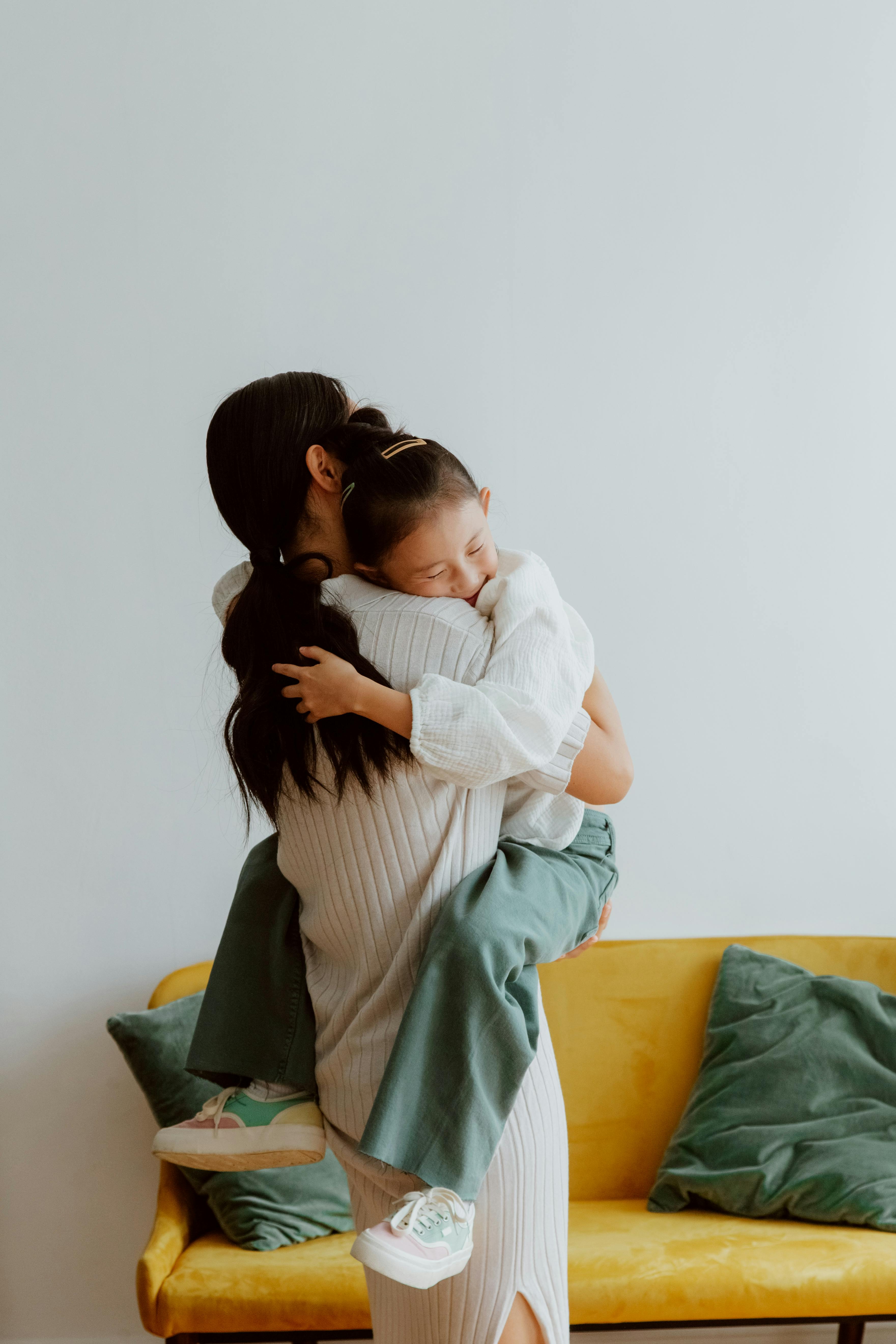 A woman hugging her daughter | Source: Pexels