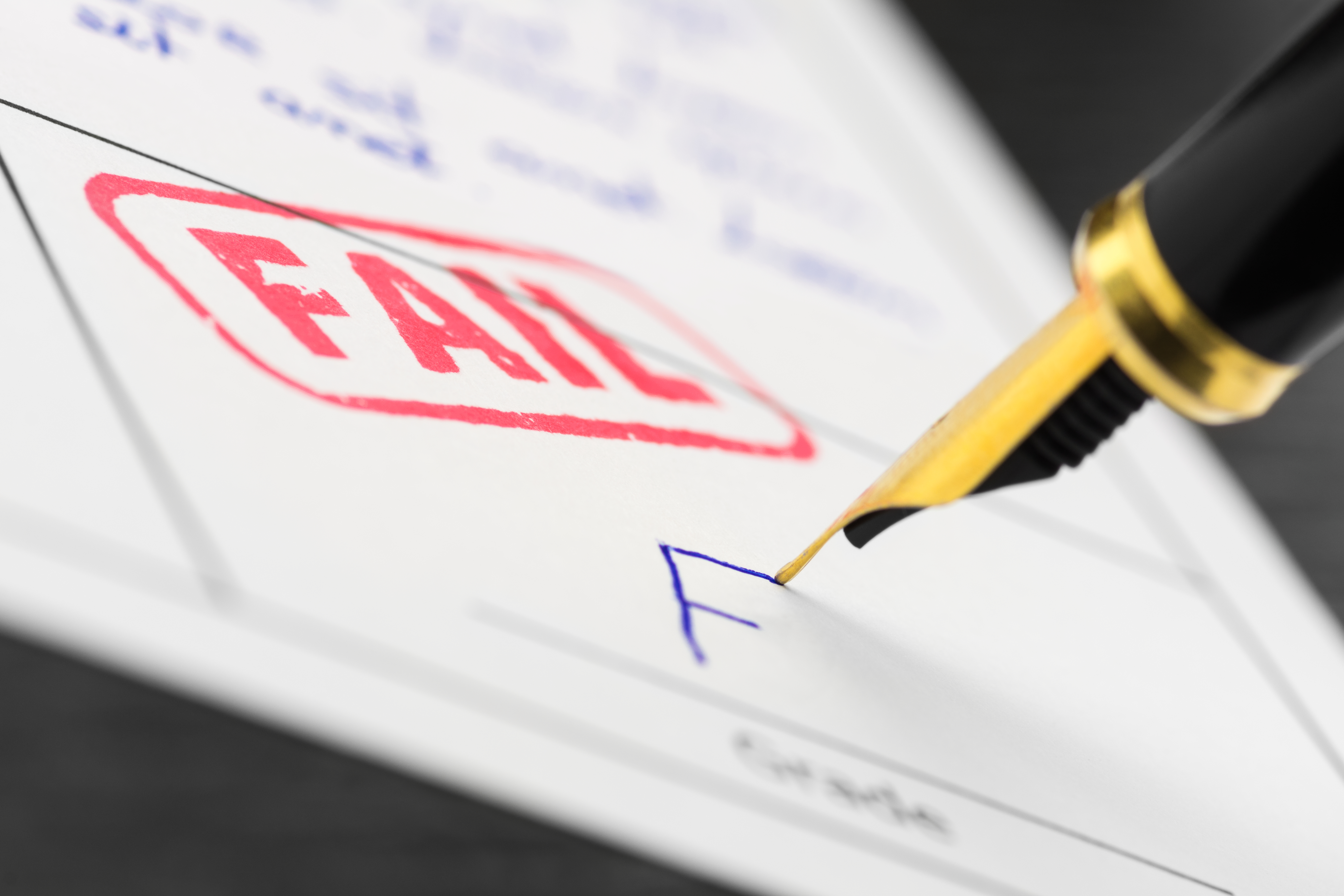 An assignment with a red "Fail" stamp on it | Source: Shutterstock